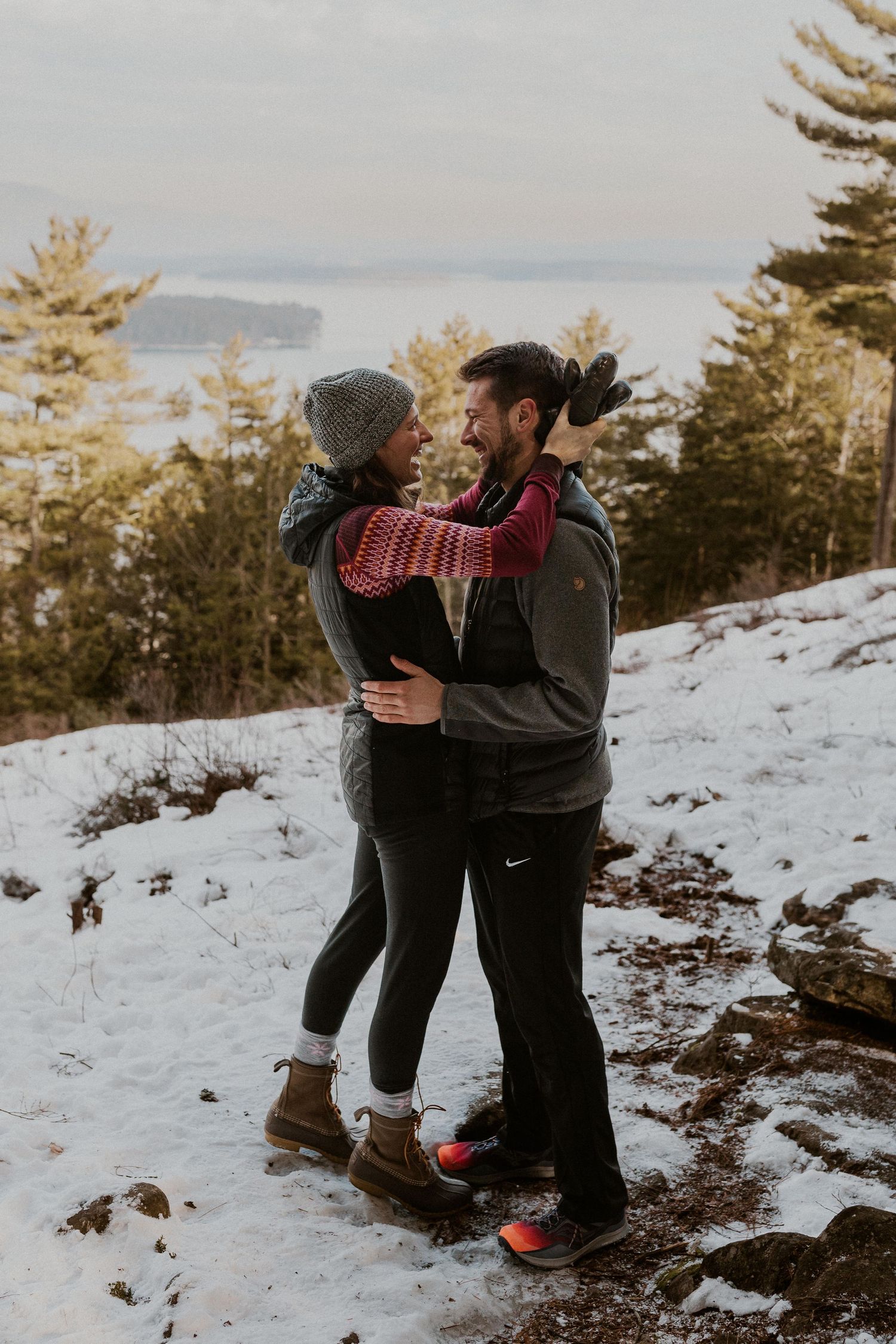 Kirsten hugging onto Ivan after he proposed to her on Lockes Hill Trail in Gilford New Hampshire.