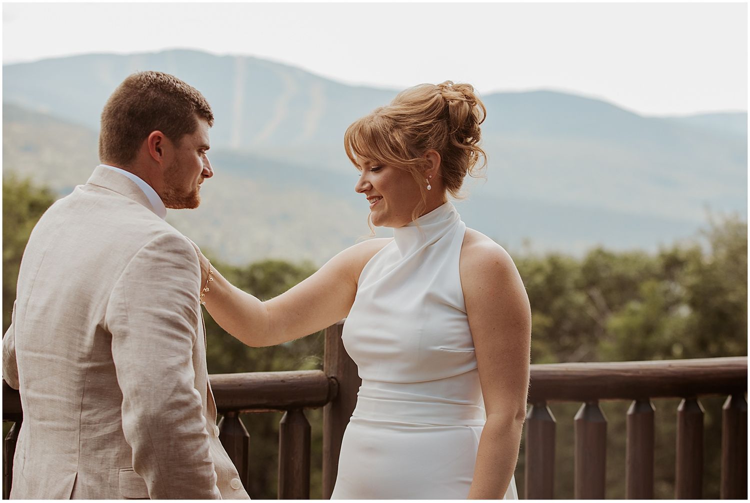 Bride and groom having their first look at their VRBO wedding in the mountains in Maine