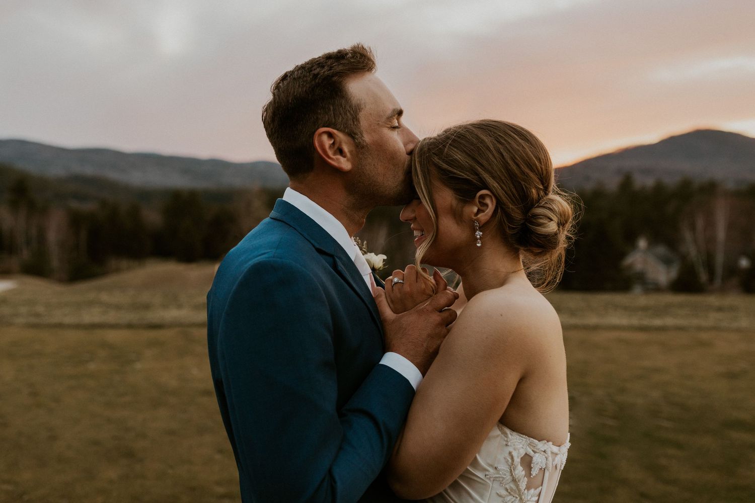 Kendra and Andrew snuggling up together during sunset portraits at the Owls Nest Resort Wedding