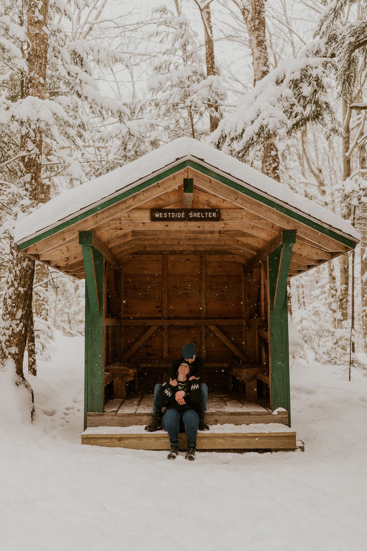 Taylor and Ken snuggling up together in a White Mountain National Forest Shelter while hiking the Flume Gorge in NH.