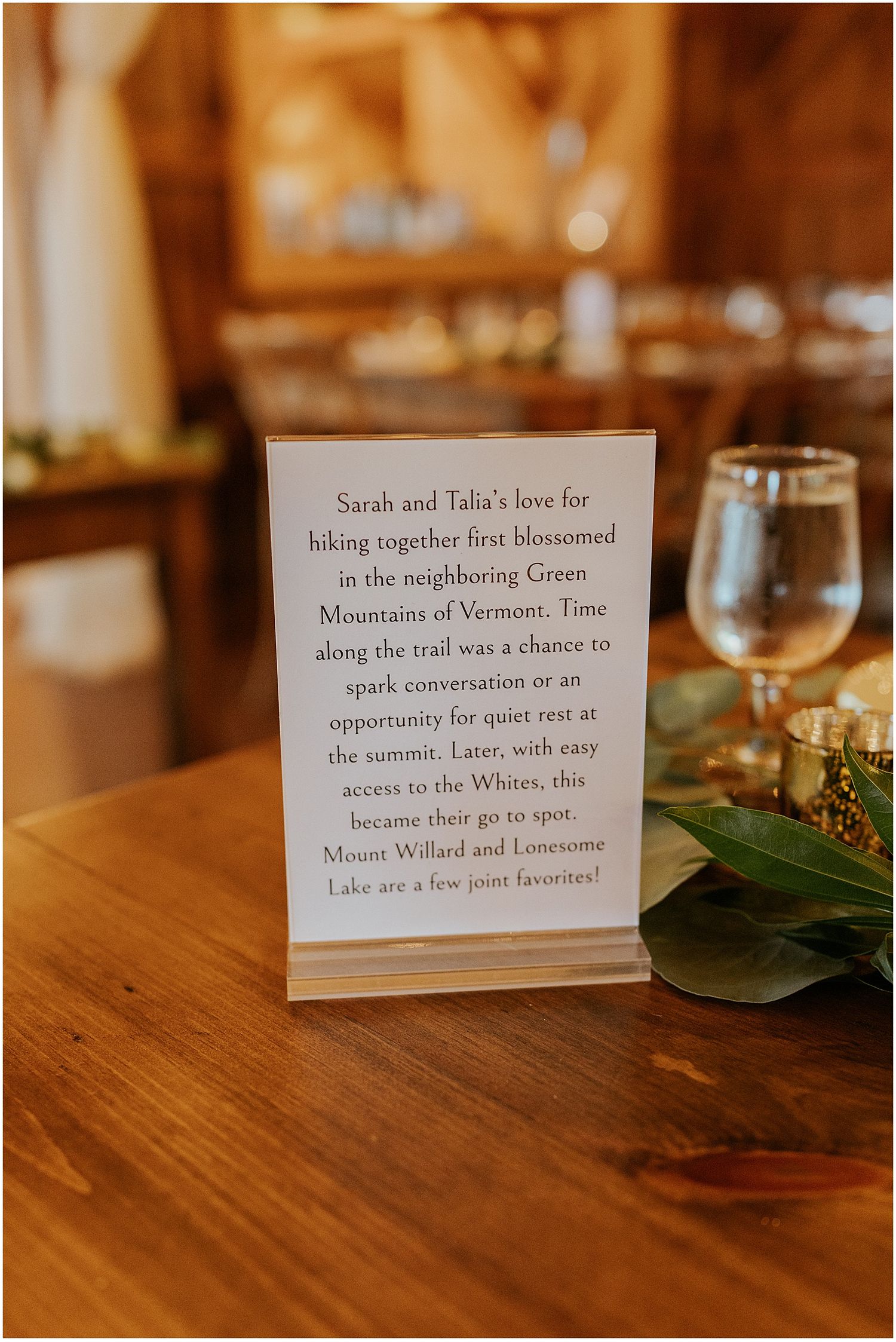 Wedding reception table number with details about the couple on the back
