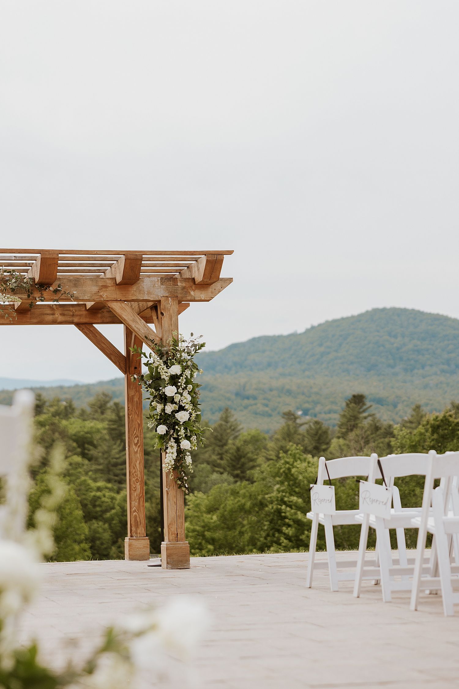 A decorated wedding ceremony arbor at the Owl's Nest resort in New Hampshire