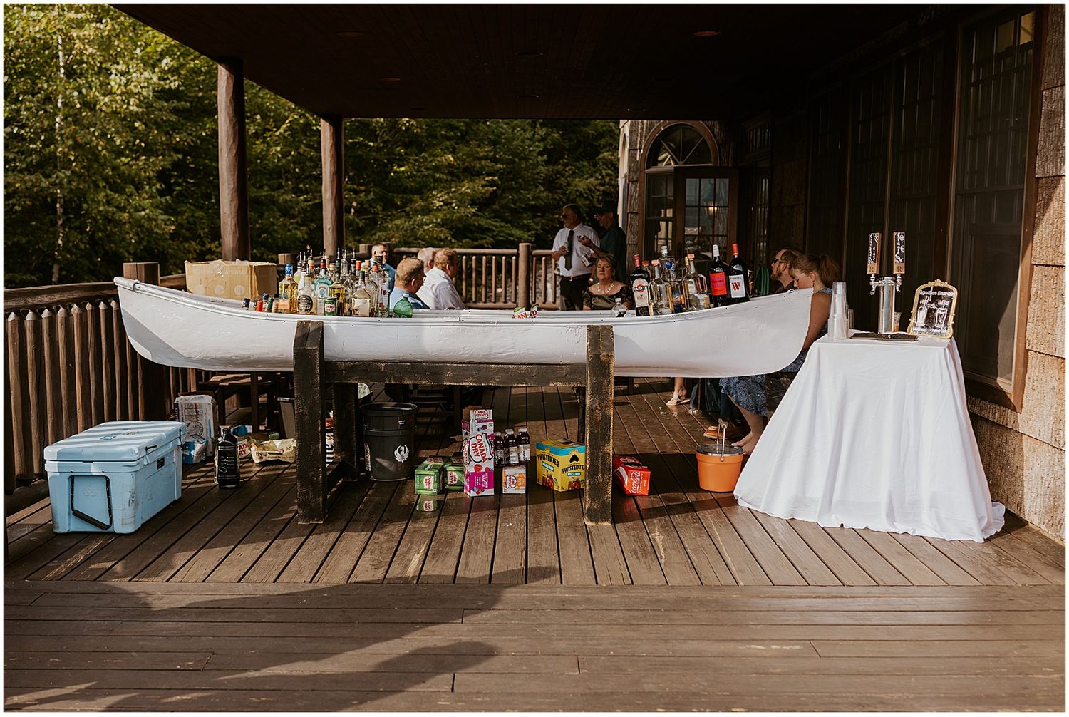 Canoe used as a bar setup at a VRBO wedding in Maine