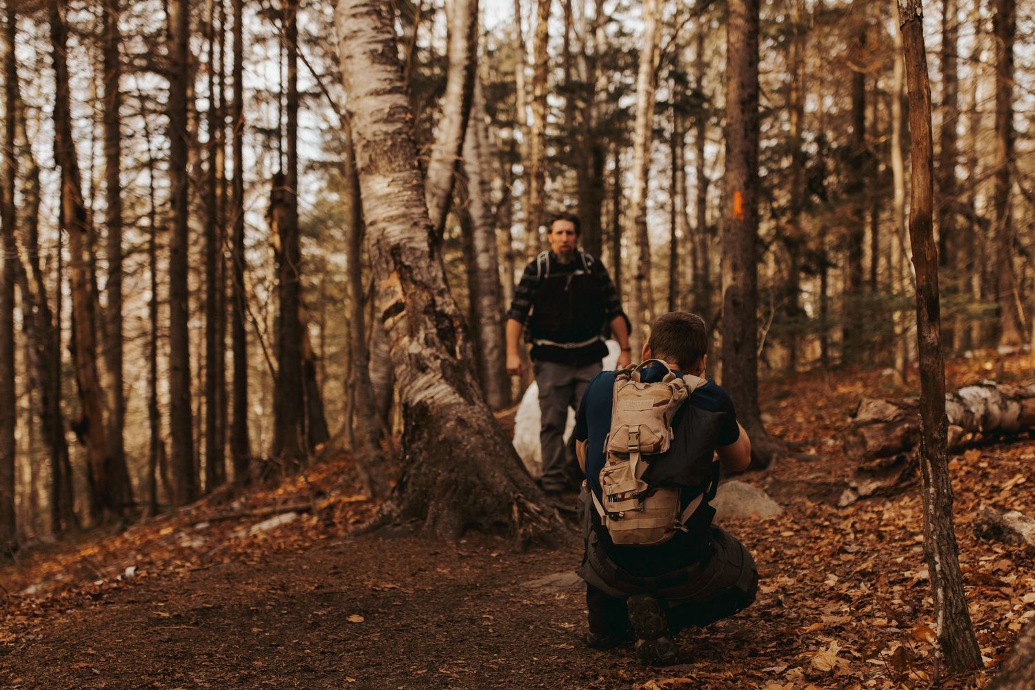 Jackie and Andy Brosonski hike the West Ridge Trail on Mount Cardigan in their wedding attire.