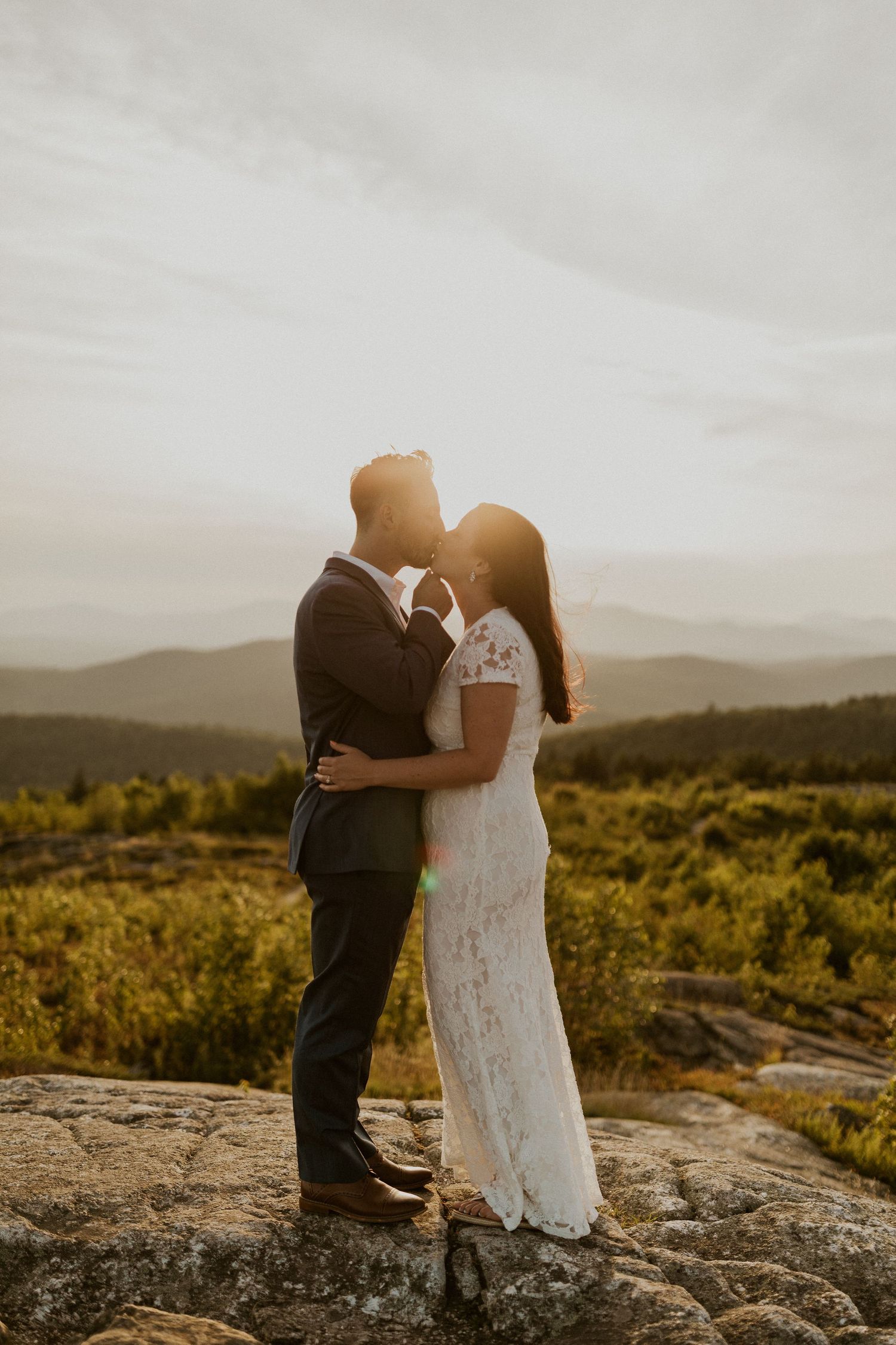Danielle and Colin dressed in their wedding attire for their one year anniversary photoshoot on Foss Mountain in NH.