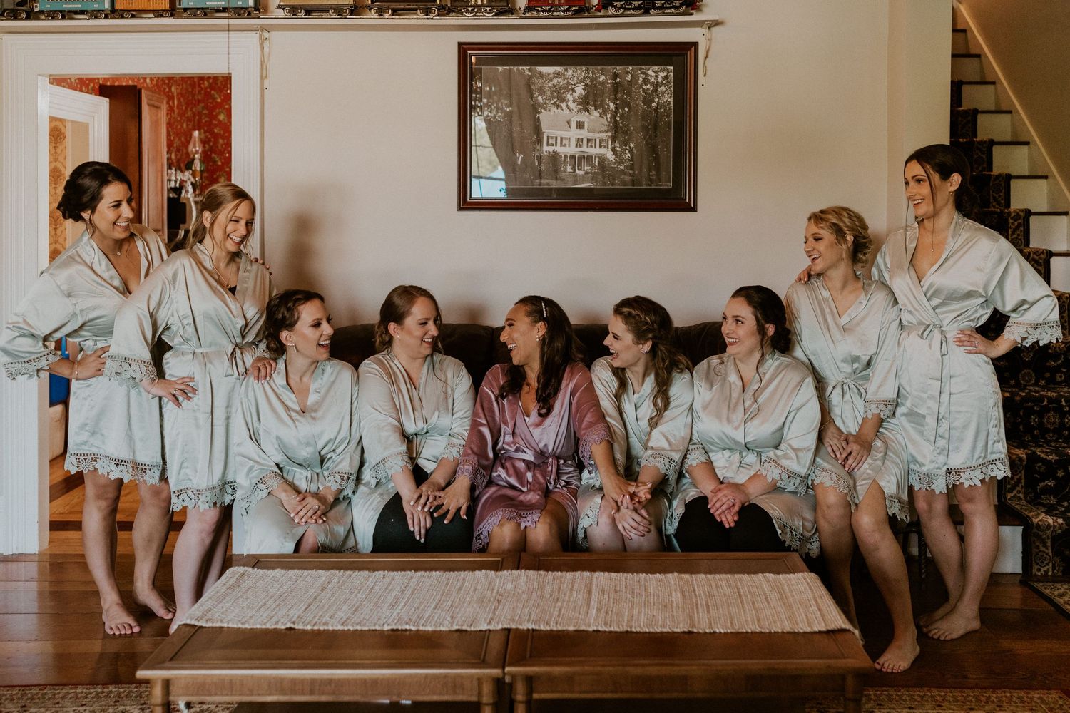 A photo of Chrissy and all of her bridesmaids in their getting ready robes.