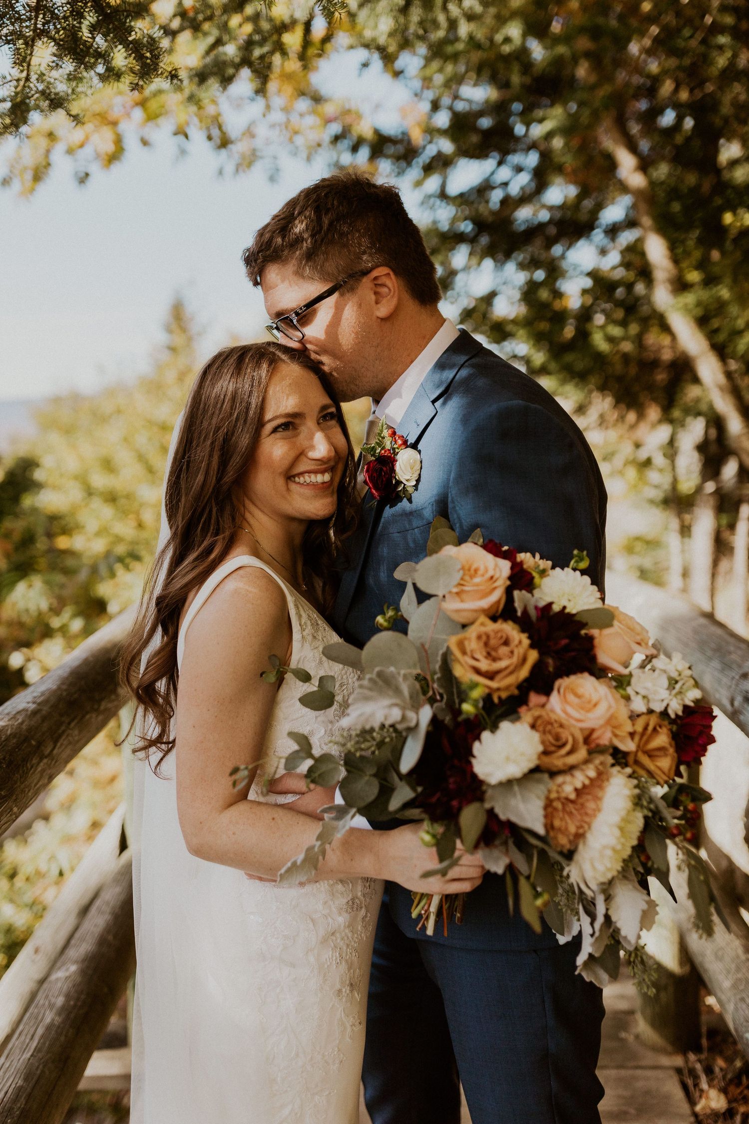 Portraits of the newlyweds on top of Loon Mountain after their fall wedding ceremony.