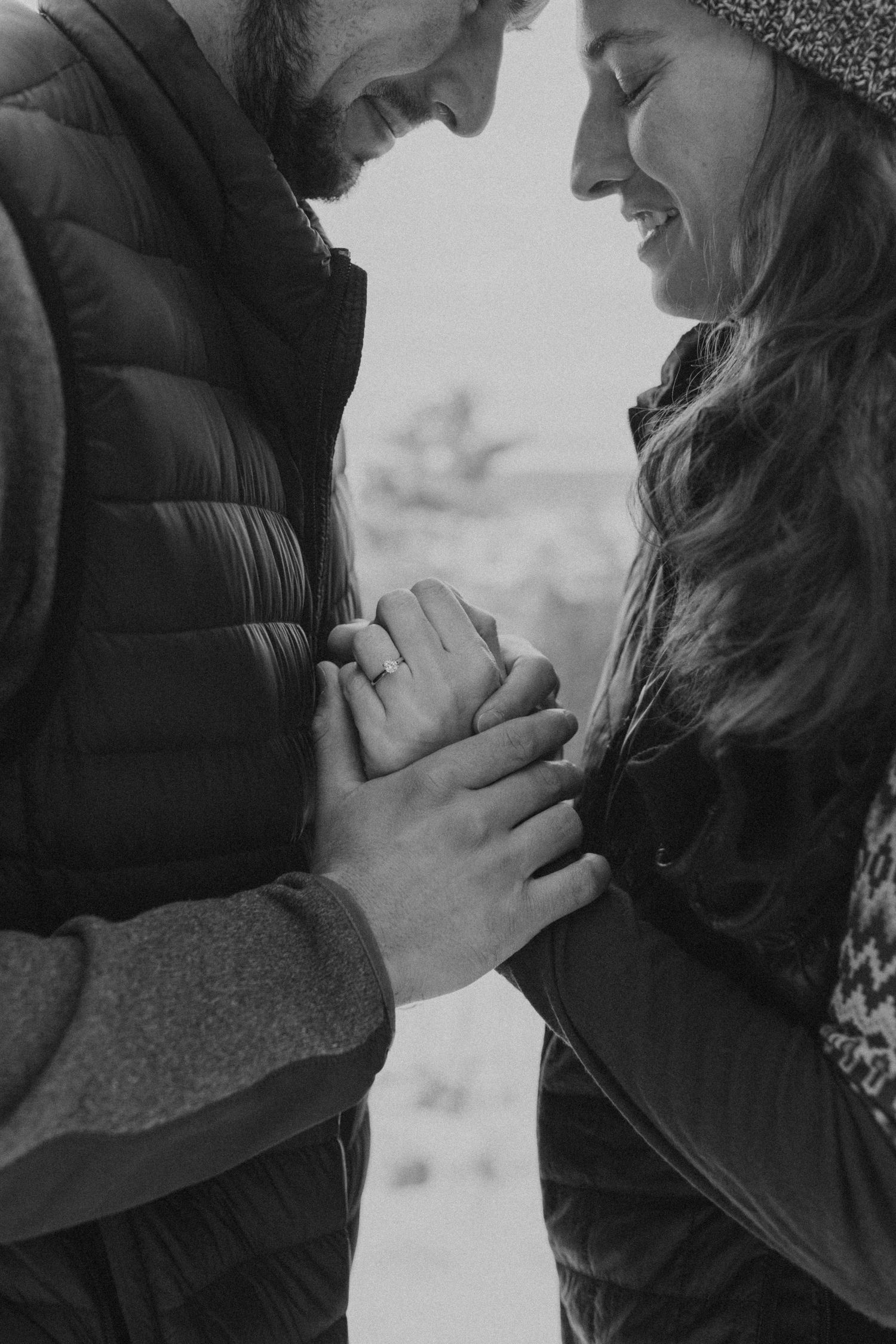 The newly engaged couple having an intimate moment together just after he proposed on Lockes Hill Trail in Gilford NH.