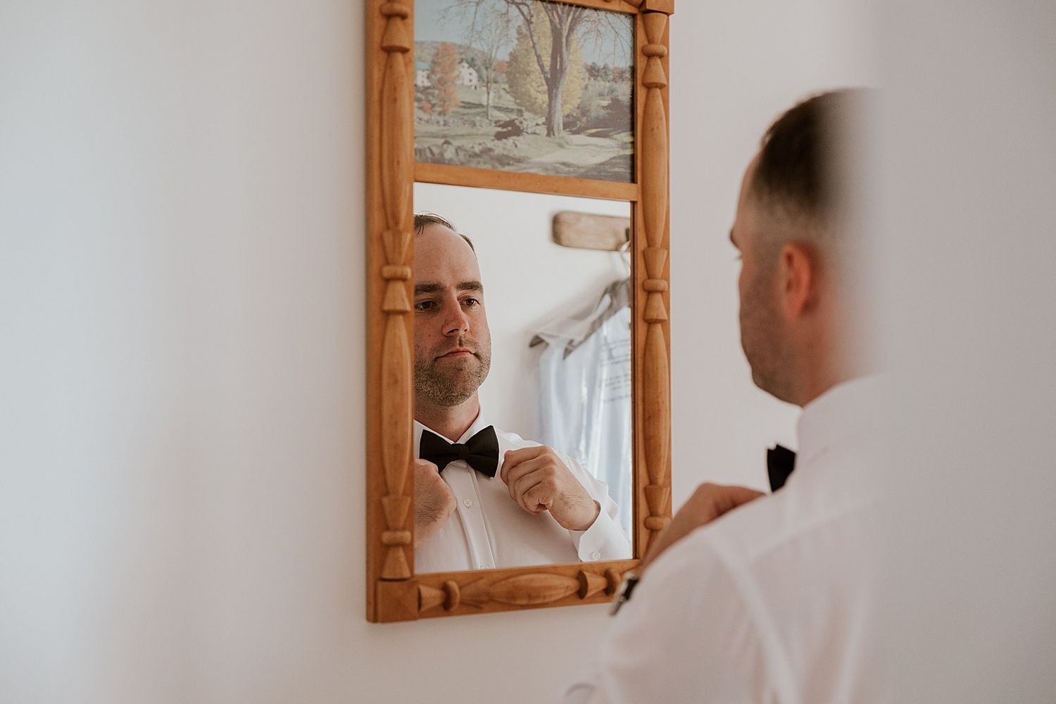 Groom getting ready for her wedding at the Owl's Nest Resort in NH