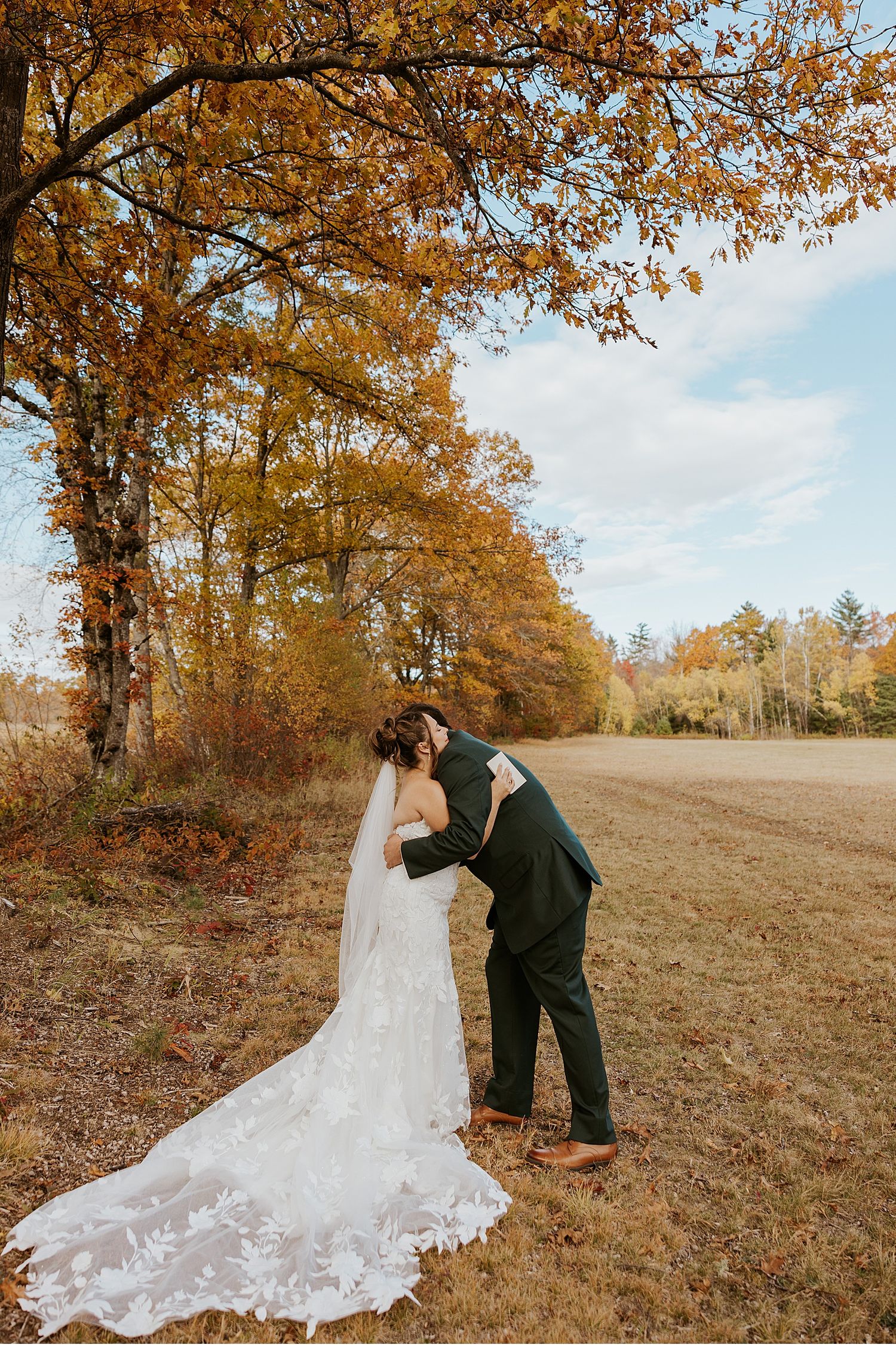Bride and groom taking first look wedding photos at their wedding in Maine
