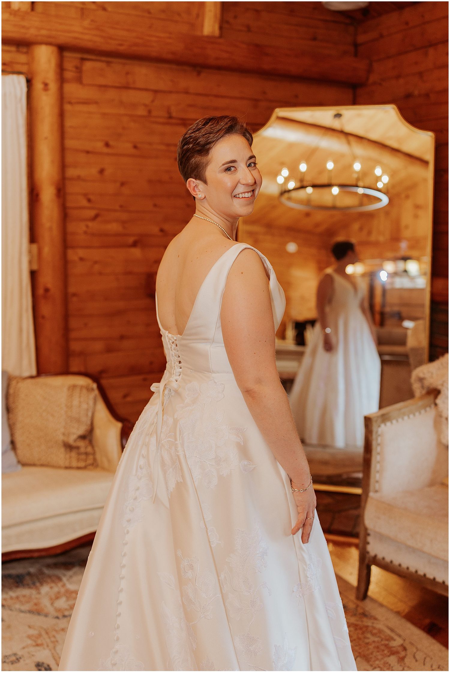 Bride getting read in a cabin for her New Hampshire wedding