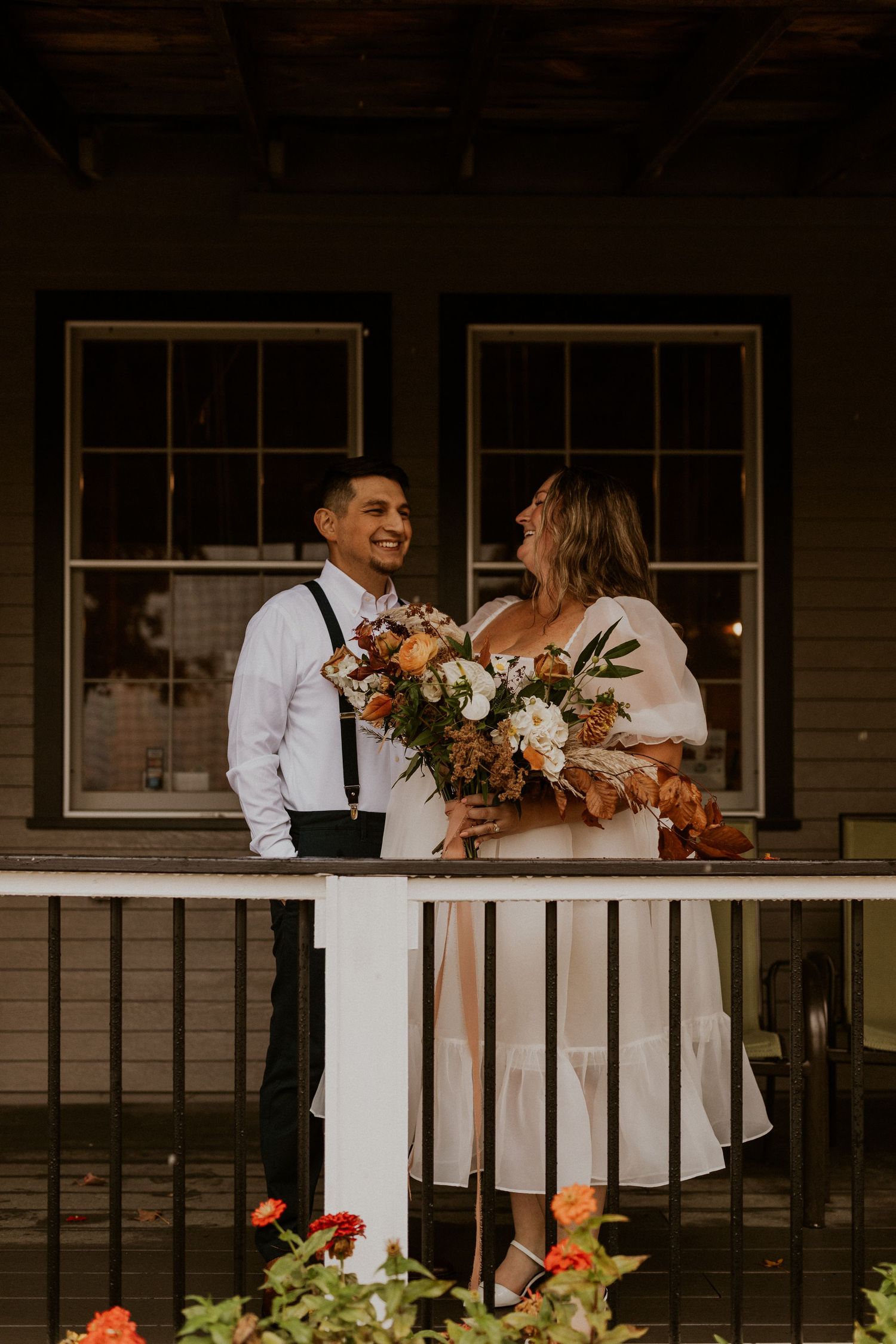 Terise and Jose spending time together on the front porch of the farm market at Carter Hill Orchard.