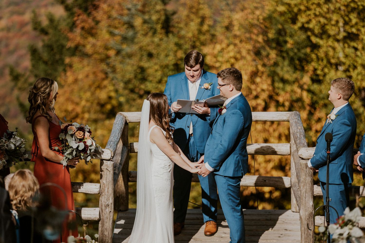 Mountaintop wedding ceremony during peak foliage in Lincoln New Hampshire.