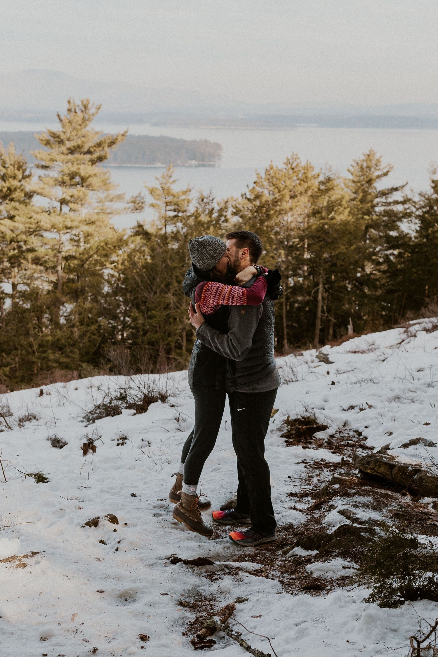 Kirsten hugging onto Ivan after he proposed to her on Lockes Hill Trail in Gilford New Hampshire.