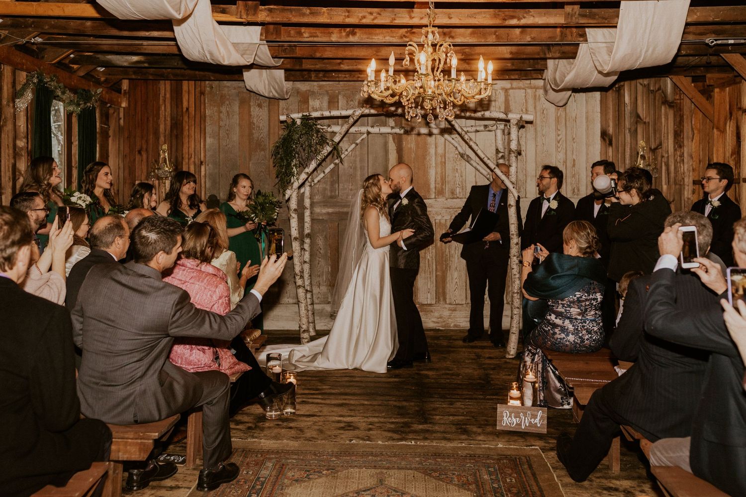 Deirdre and Brodie sealing their marriage with a kiss at their wedding at The Preserve in Tamworth New Hampshire.