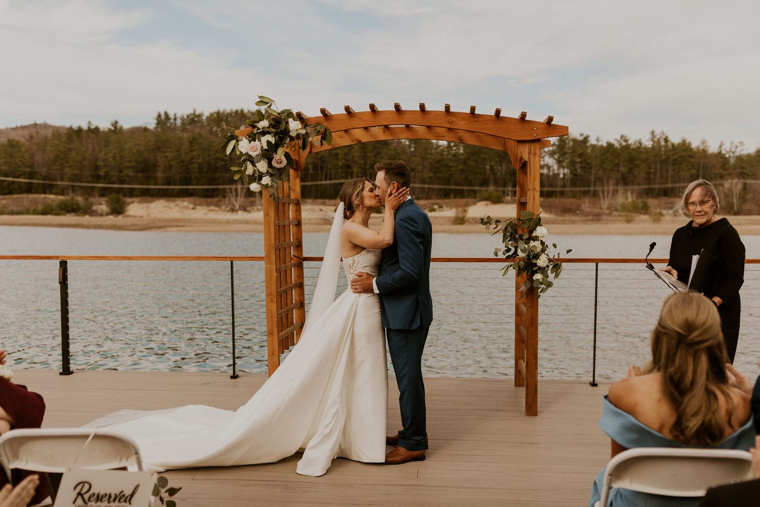Kendra and Andrew sharing their first kiss as husband and wife on their wedding day.