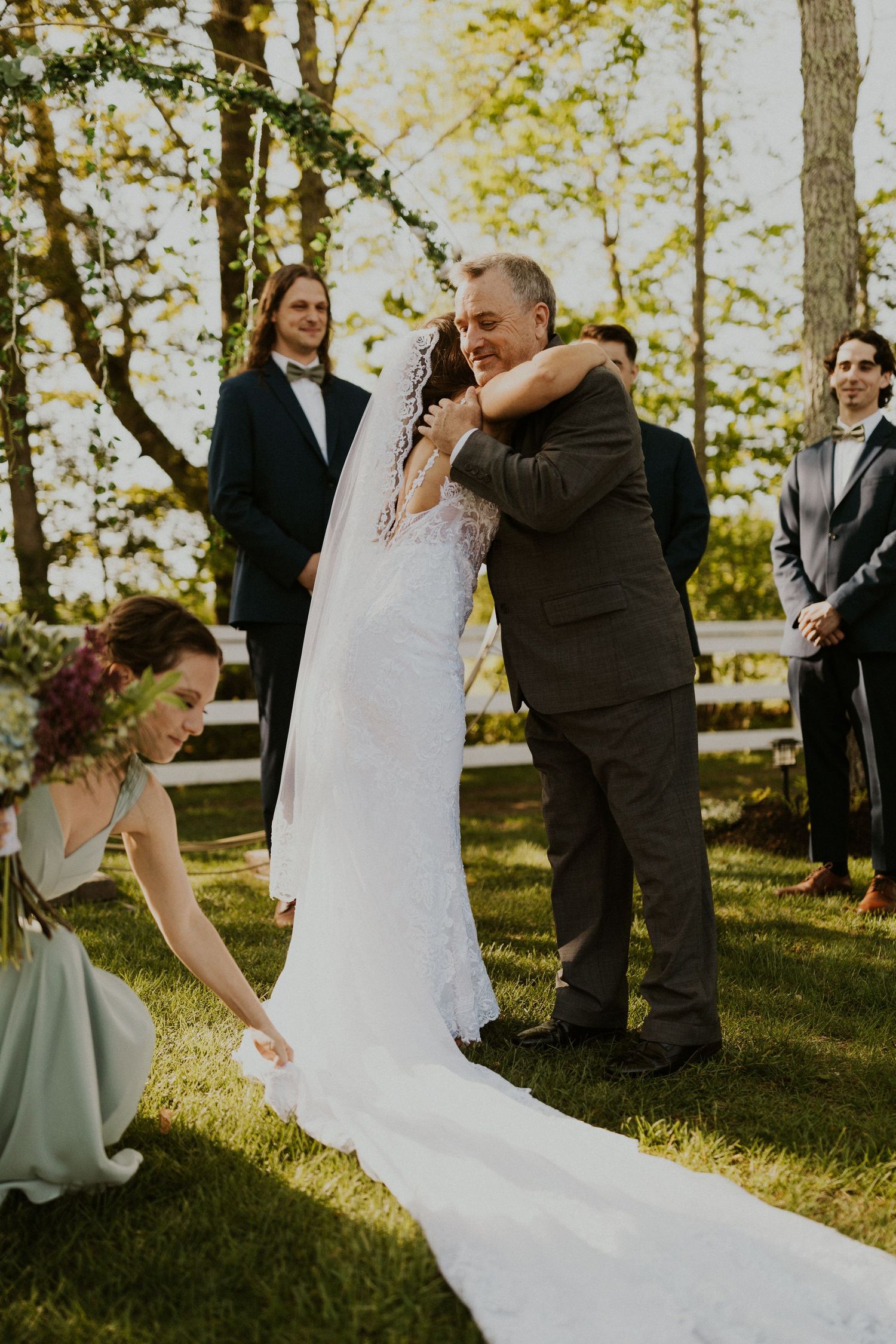Chrissy hugging her Dad at the start of the wedding ceremony.
