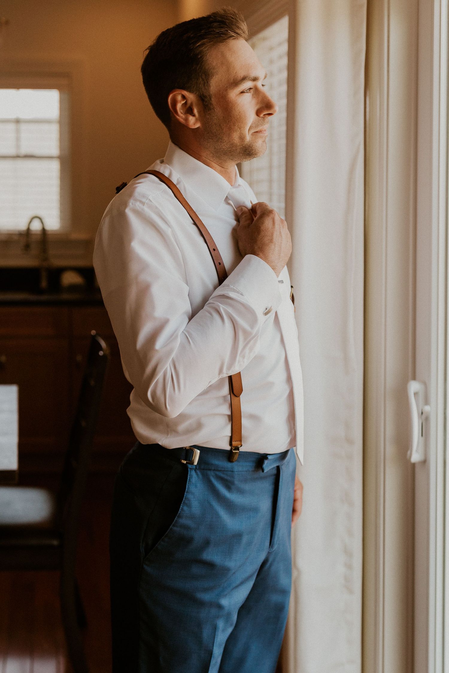 Andrew getting ready for the wedding ceremony at Owl's Nest Resort Lake House.