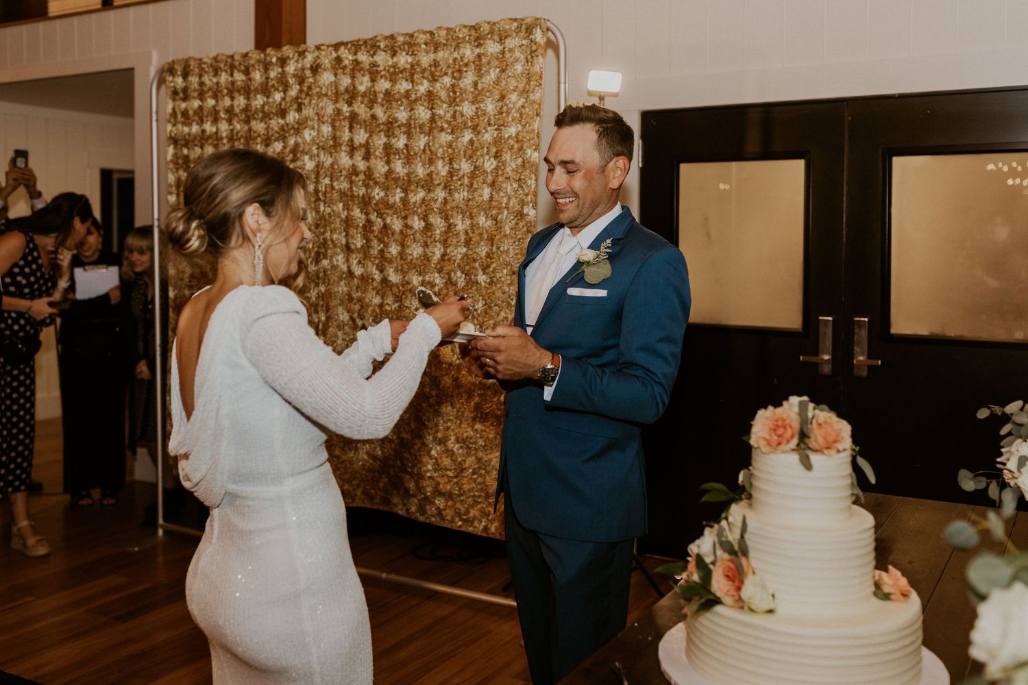 Kendra feeding the groom cake at their Owl's Nest Resort wedding.