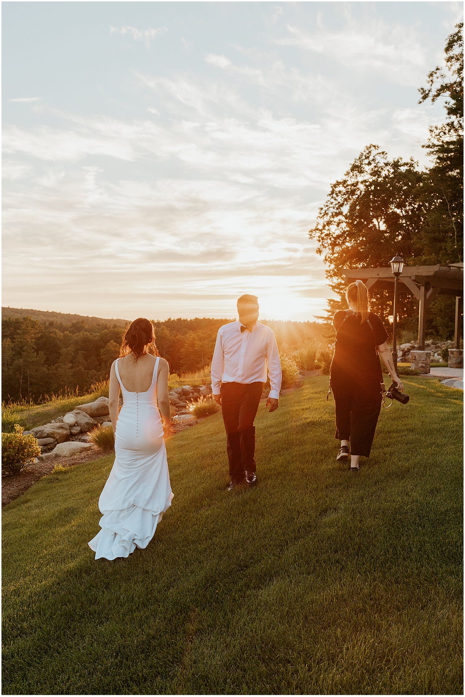 NH wedding photographer Robin Easler photographing a bride and groom at sunset