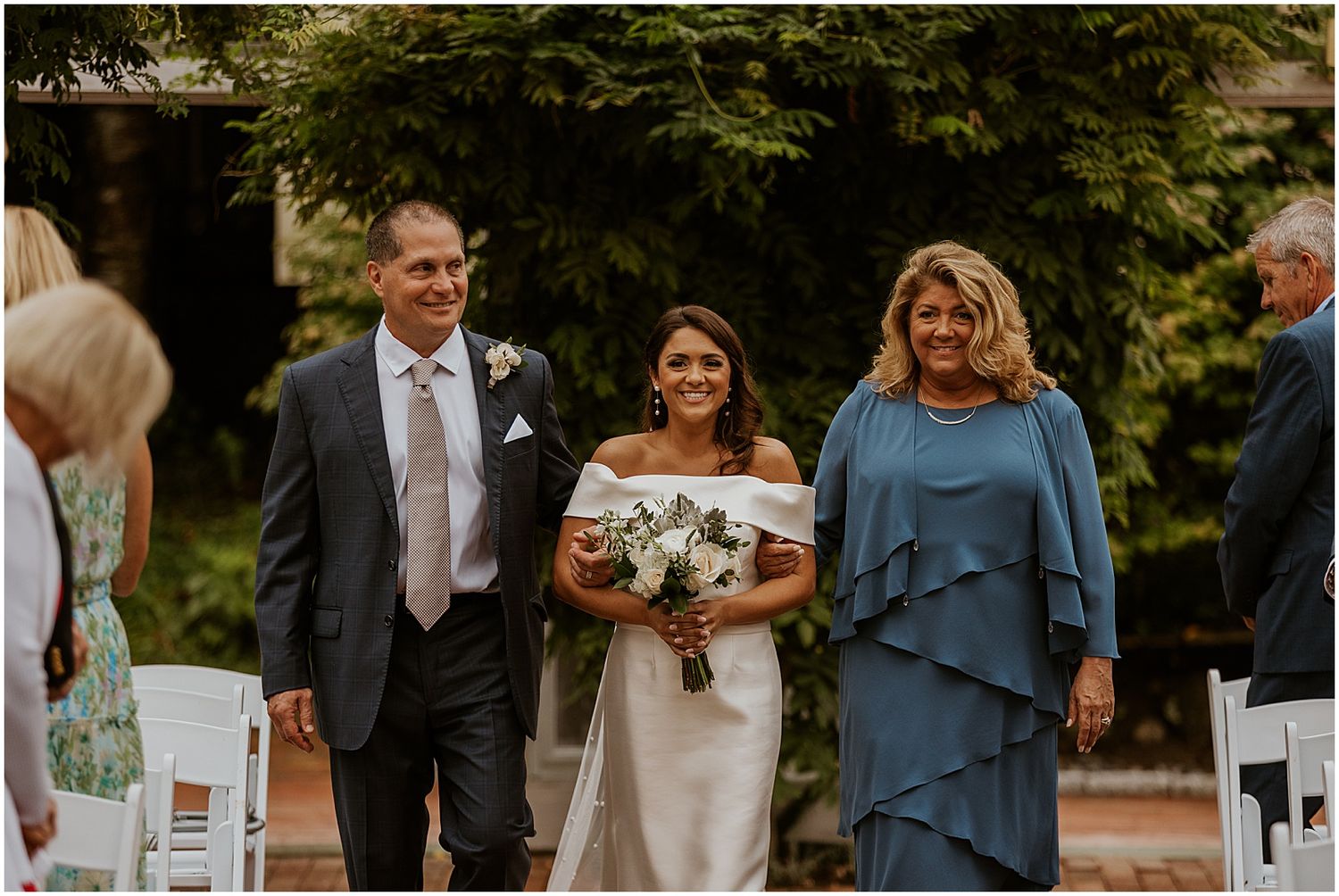Bride walking down the aisle with parents NH wedding