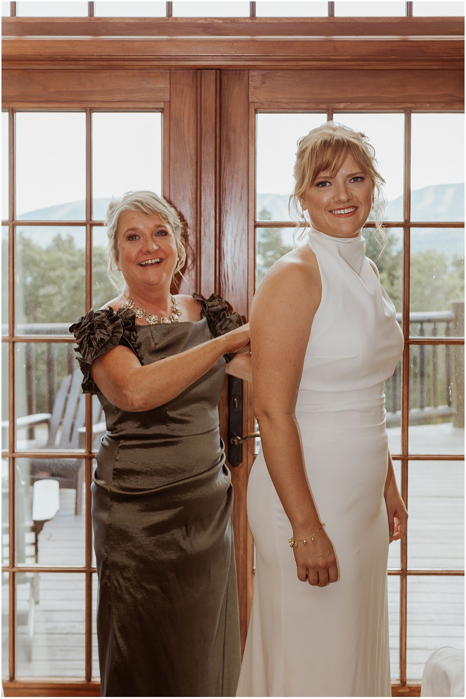 Bride getting ready with her mother for her Maine wedding
