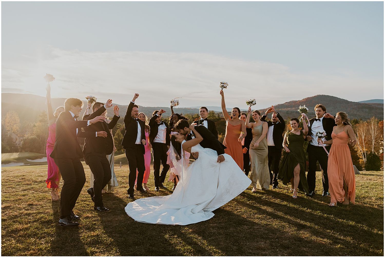 NH wedding party taking golden hour wedding photos