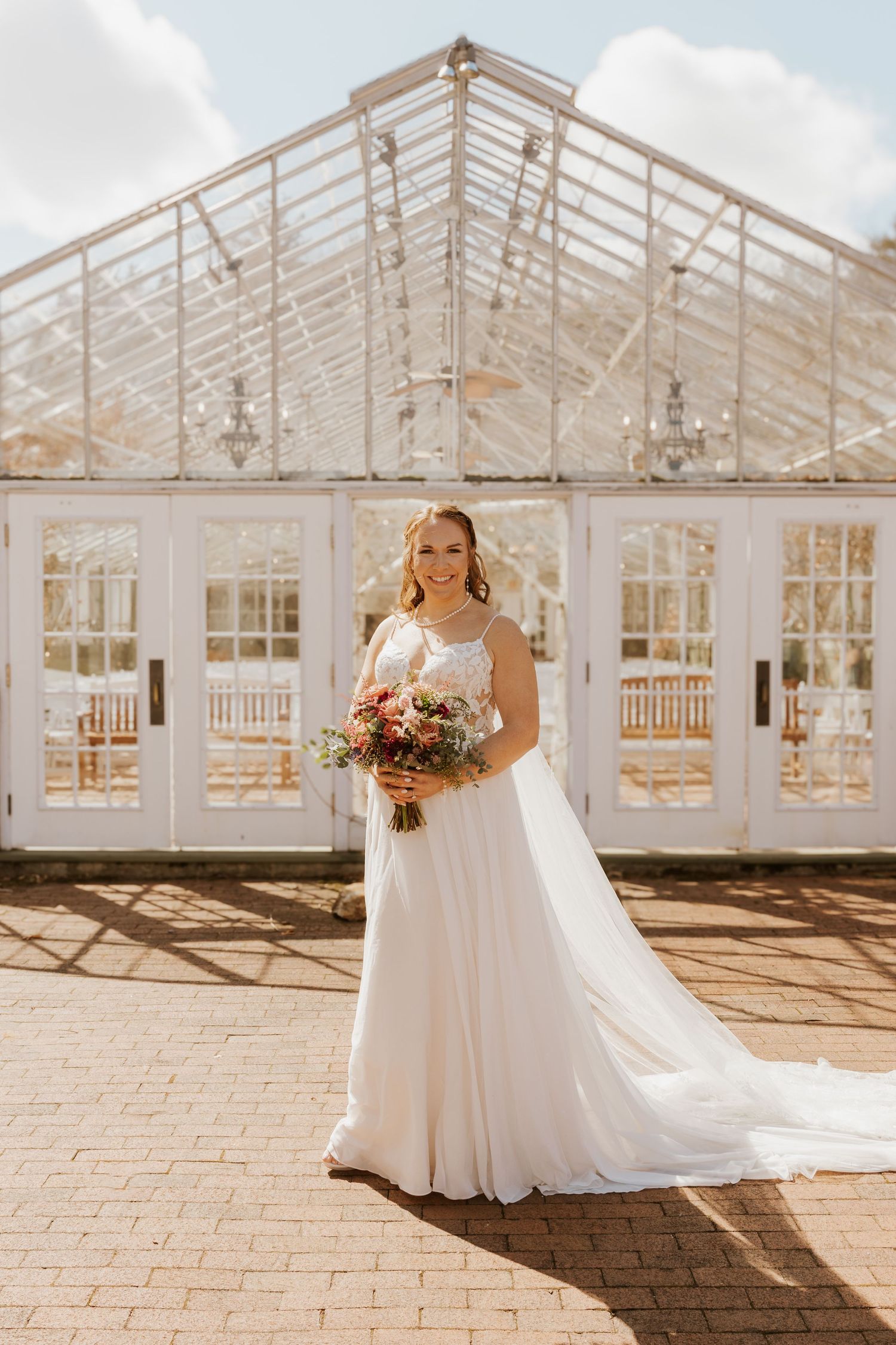A series of photos showing a bride in a white gown posing in front of a sunlit glass greenhouse conservatory.