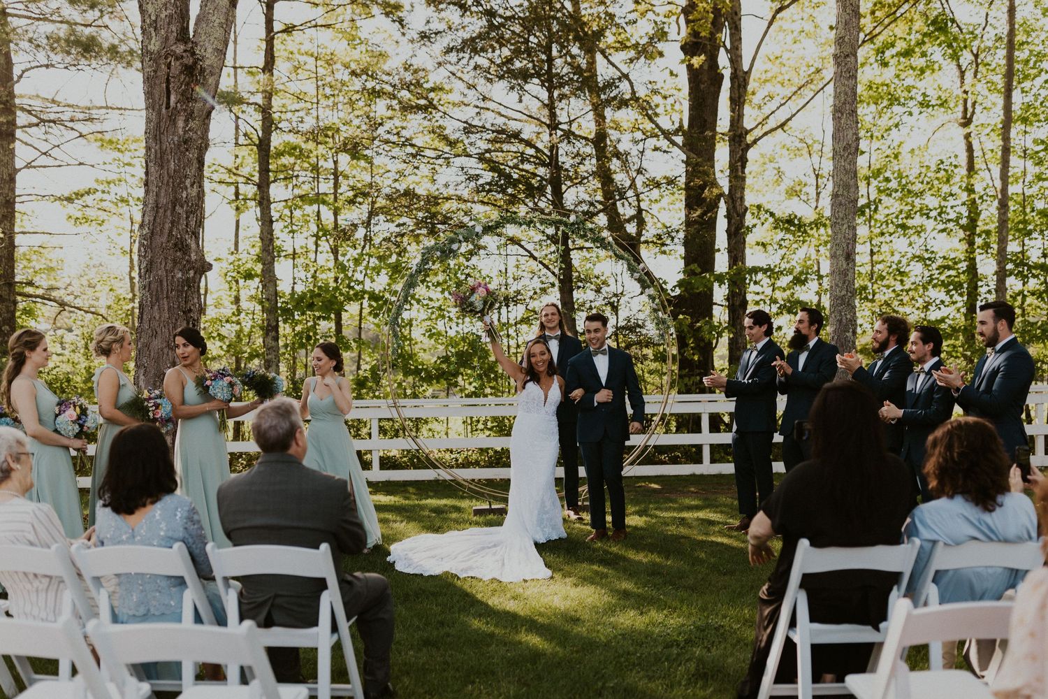 Chrissy and Mike celebrate and walk back up the aisle as newlyweds!