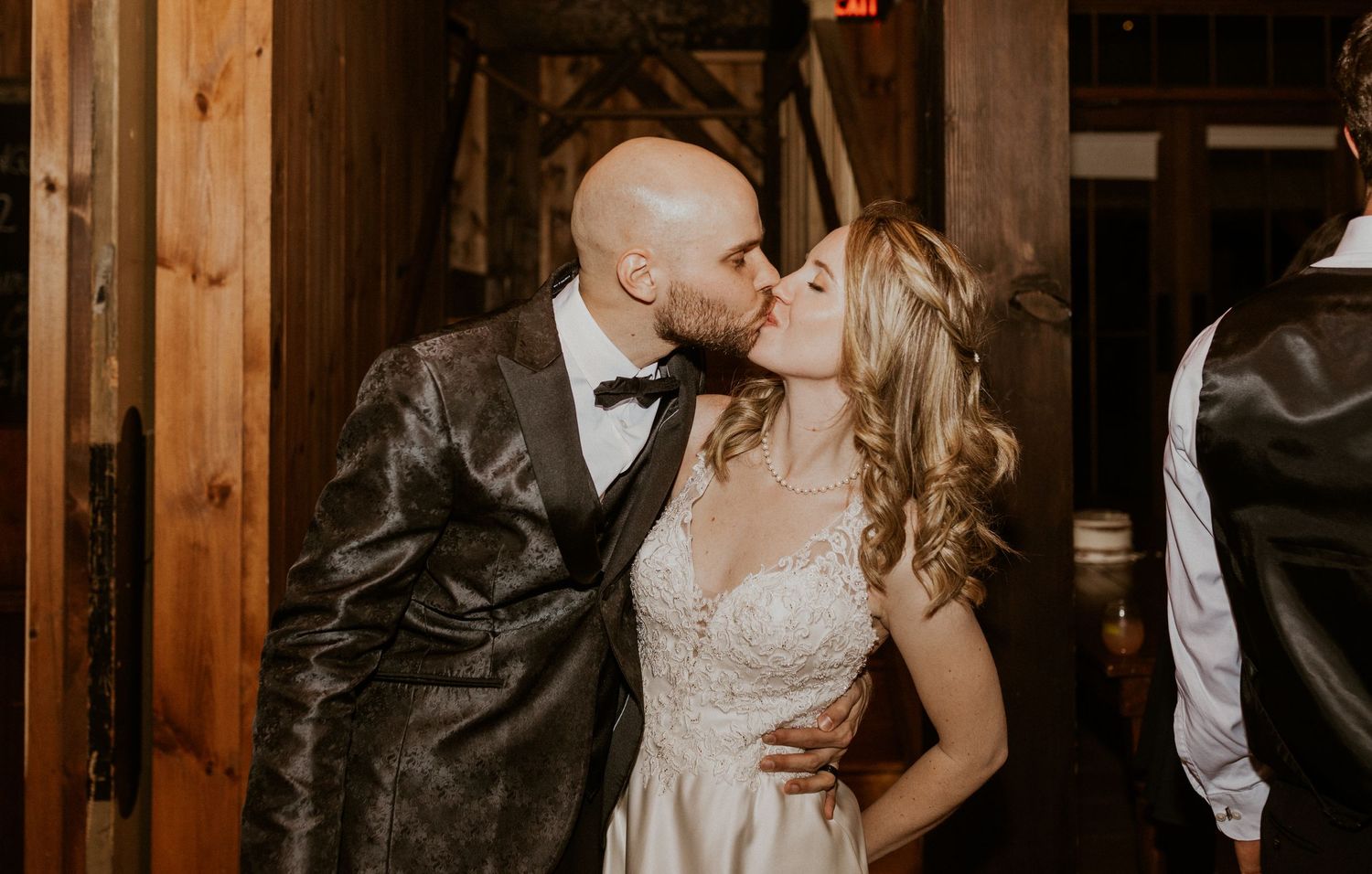 Deirdre and Brodie kissing during their wedding reception.