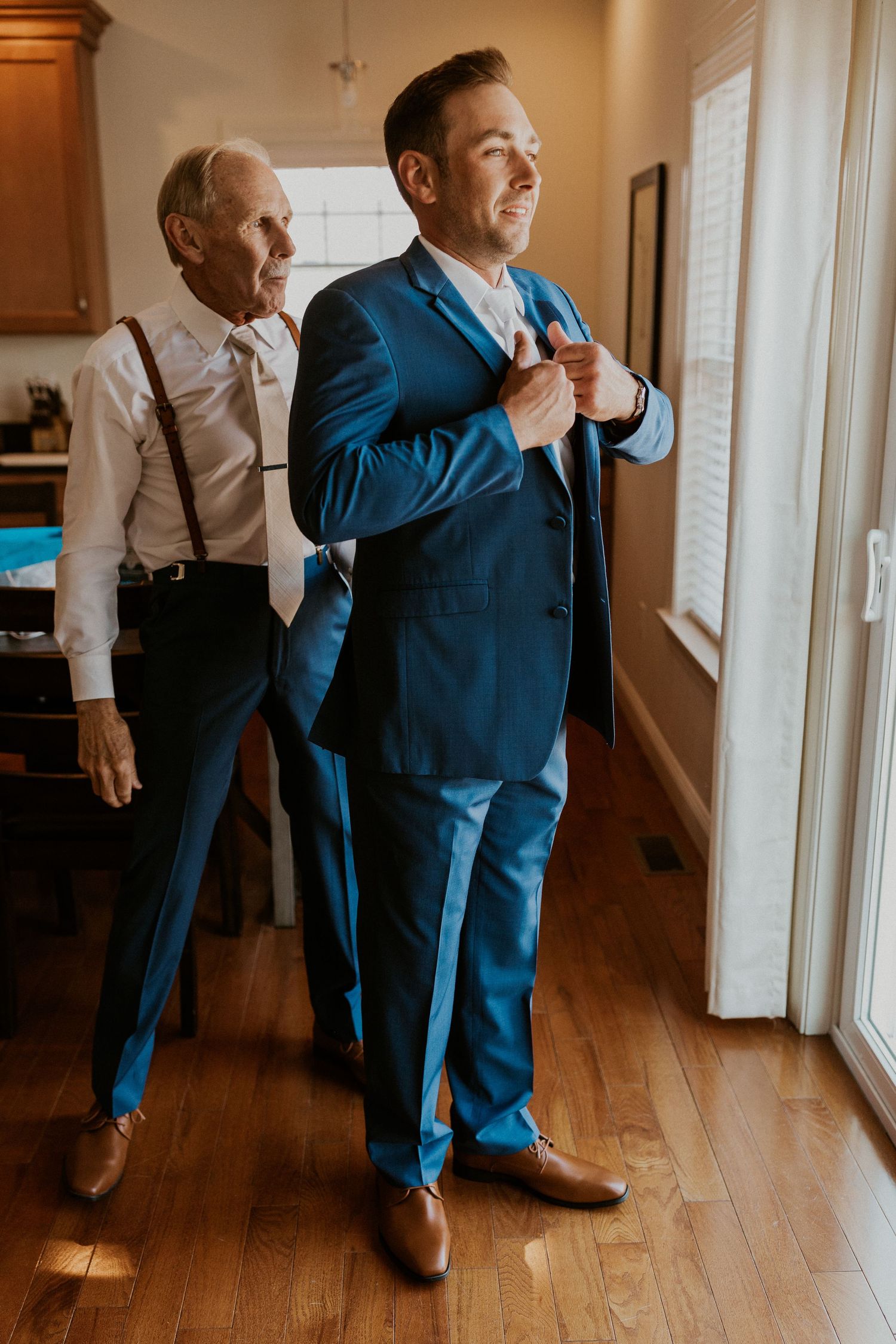 Andrew and his Dad getting ready for the wedding ceremony at Owl's Nest Resort Lake House.