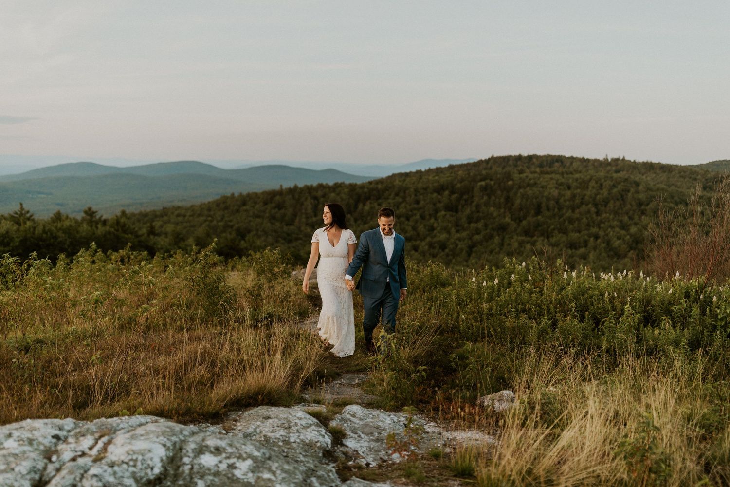 Danielle and Colin dressed in their wedding attire for their one year anniversary photoshoot on Foss Mountain in NH.