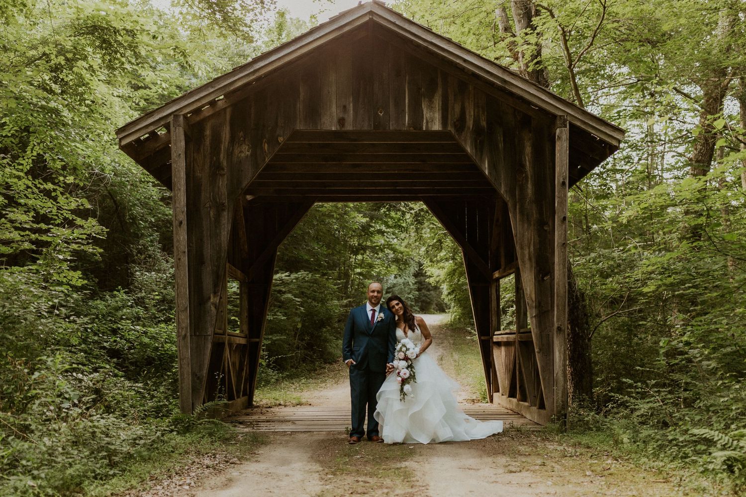 Series of photos showing a covered wooden bridge in a forest setting.
