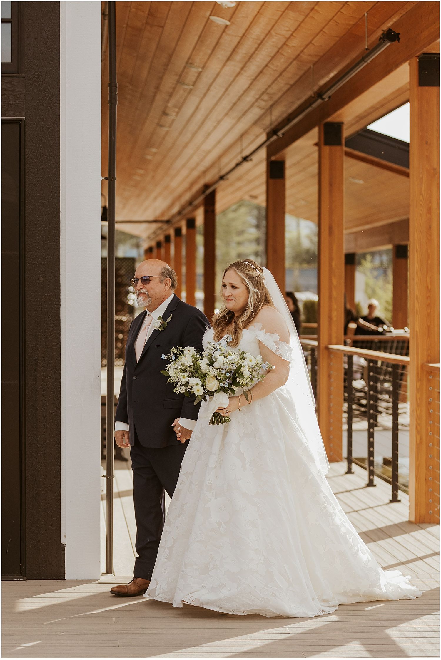 Bride walking down the aisle with her dad at her NH wedding