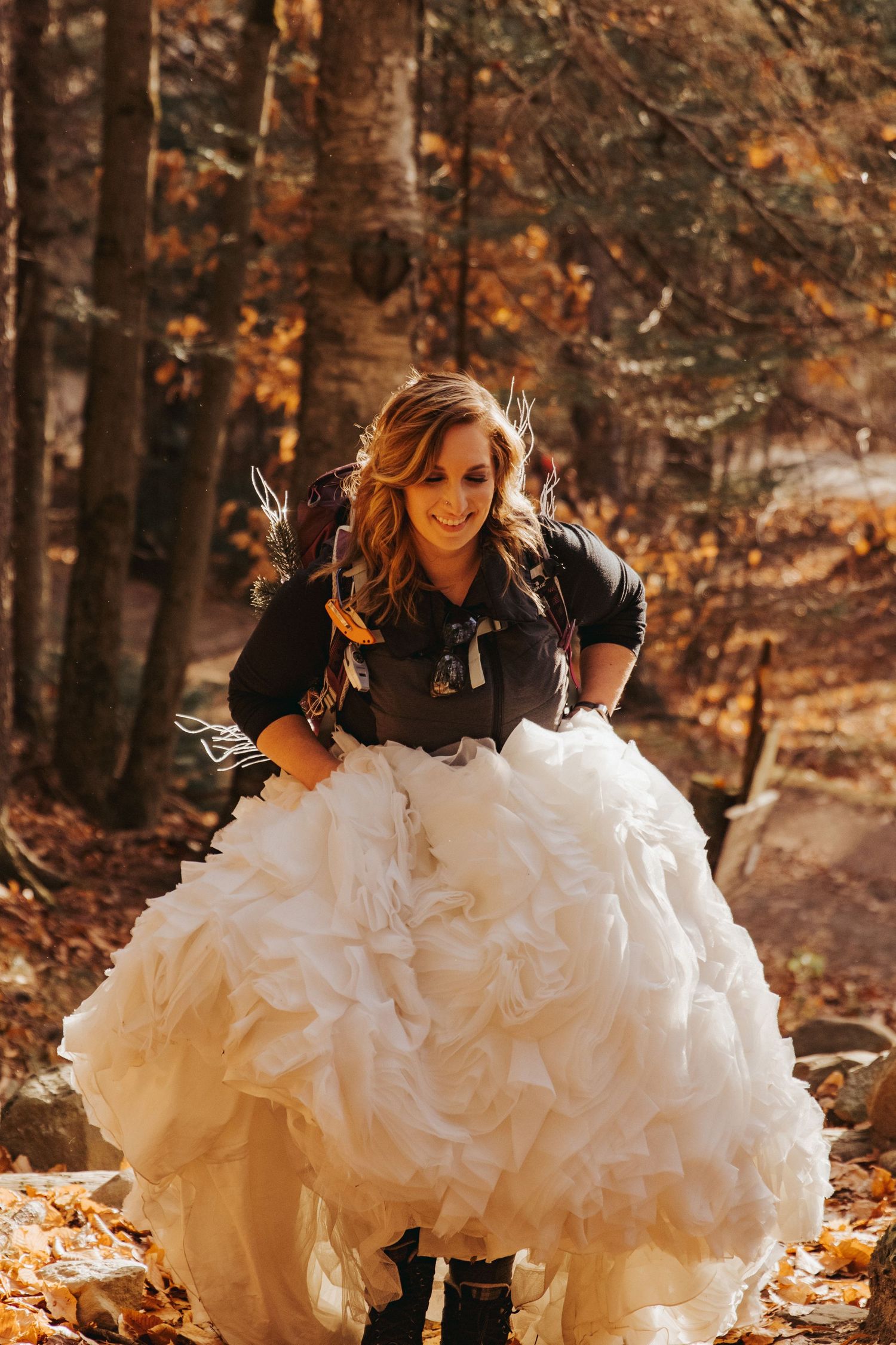 Jackie and Andy Brosonski hike the West Ridge Trail on Mount Cardigan in their wedding attire.