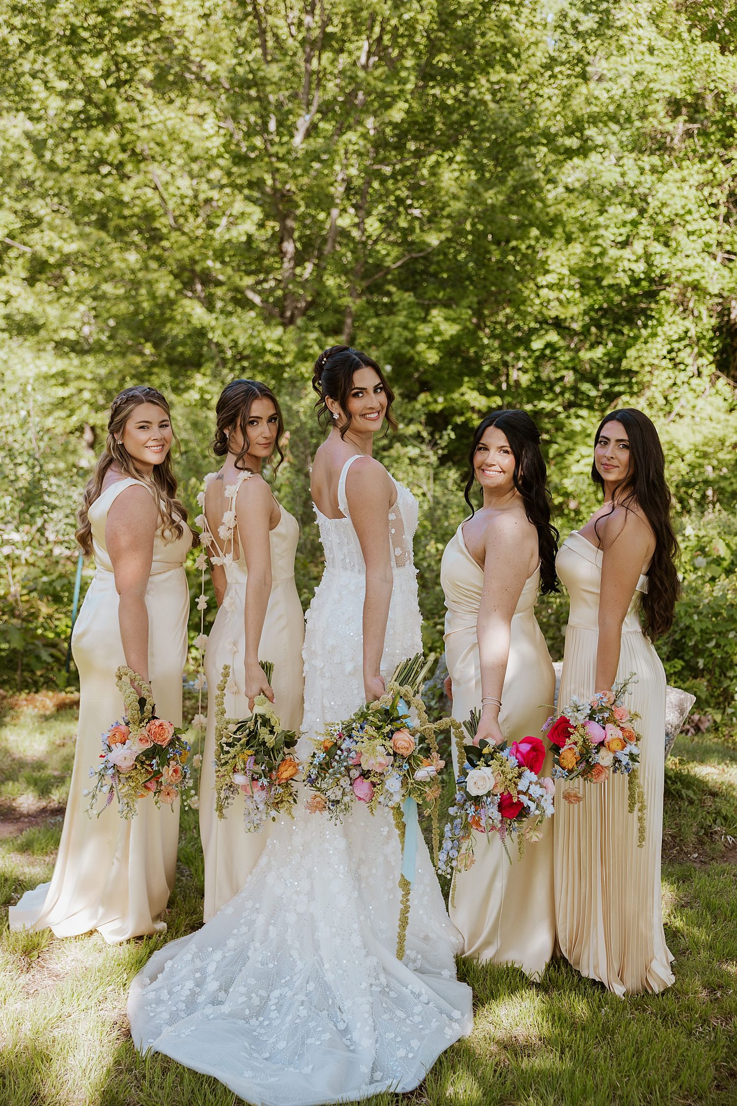Bride and her bridesmaids taking portraits at a NH wedding