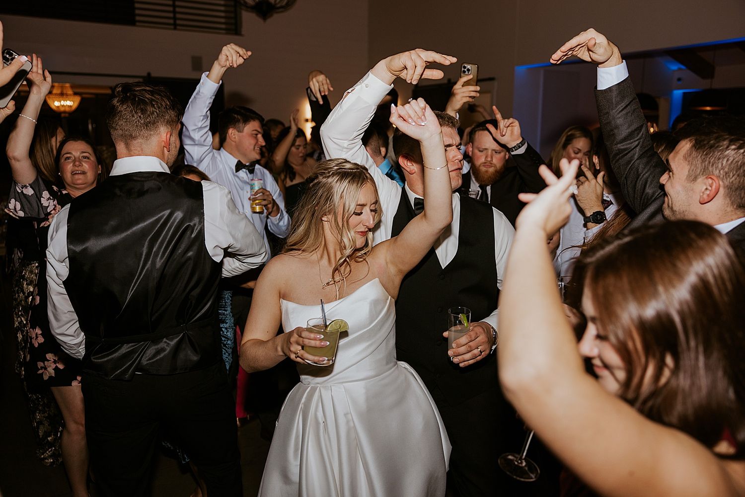 Bride and groom dancing with their guests at their New Hampshire wedding reception