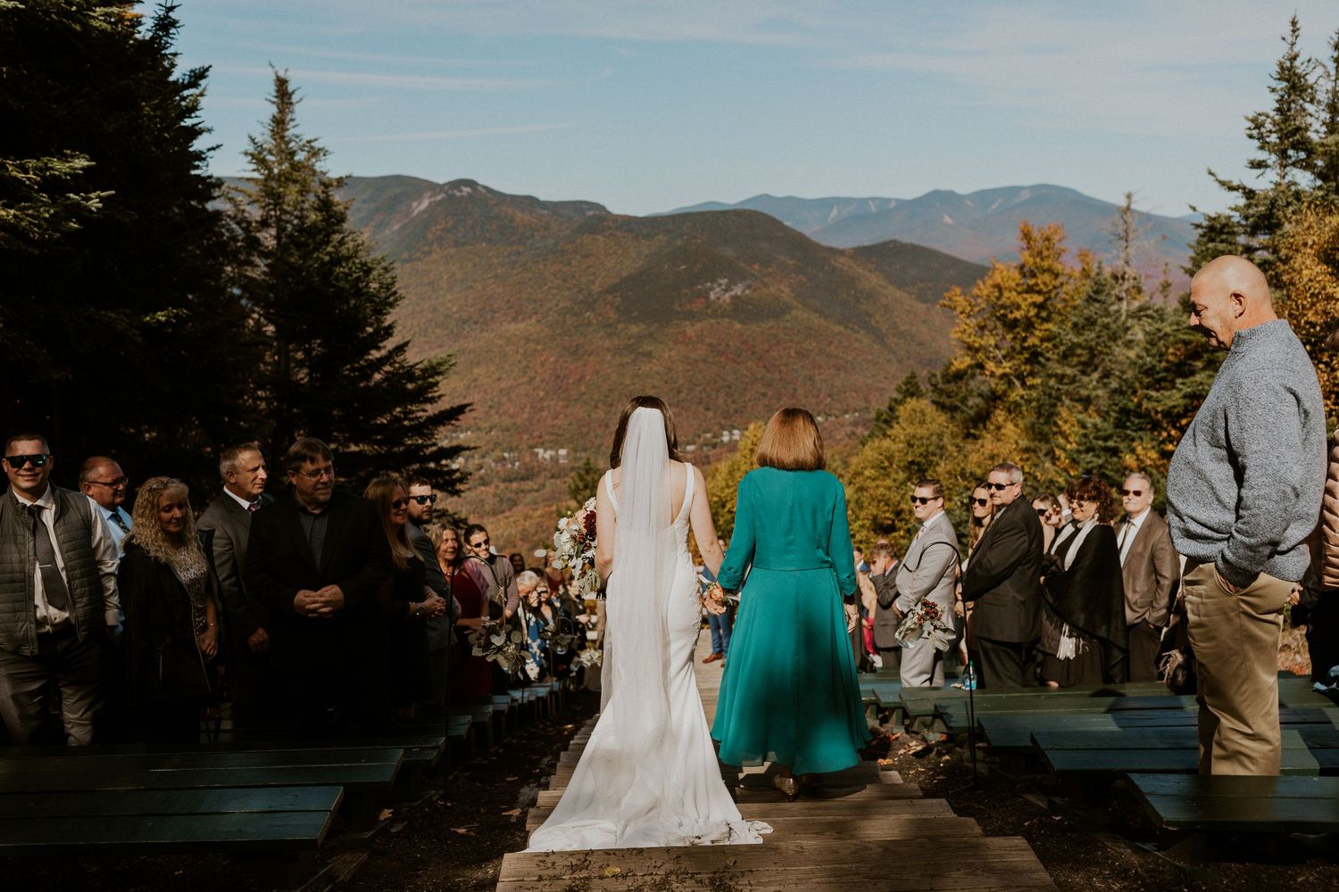 Bri walking down the aisle with her mother during the wedding ceremony on Loon Mountain.