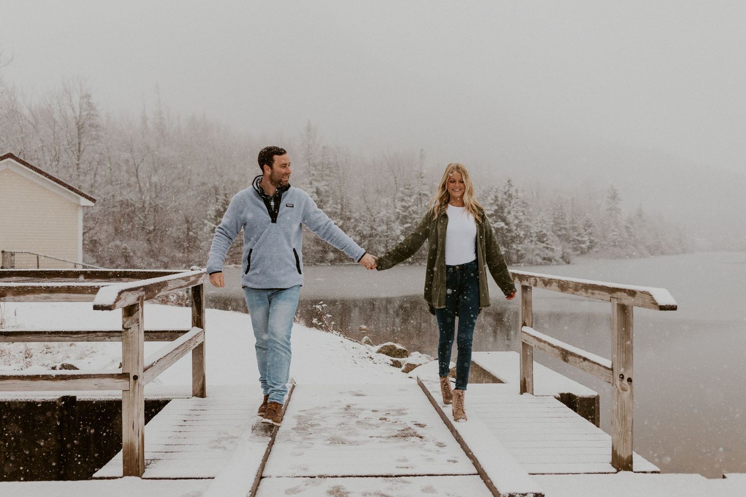 Newly engaged couple playfully posing for photos during their engagement session in Franconia New Hampshire.