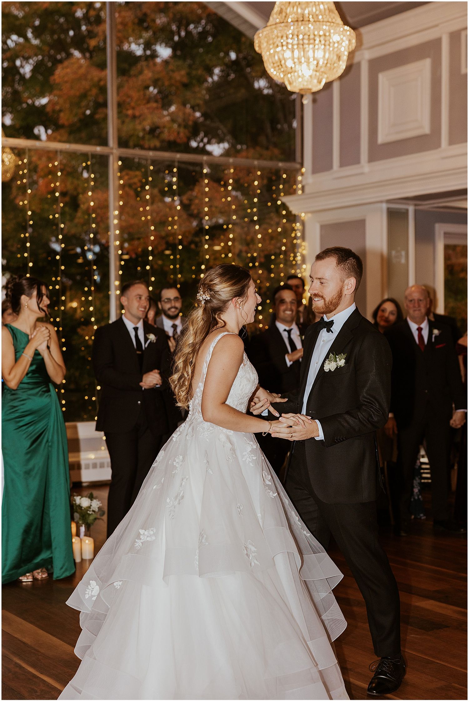 Wedding reception dance floor with twinkle lights and elegant decor.