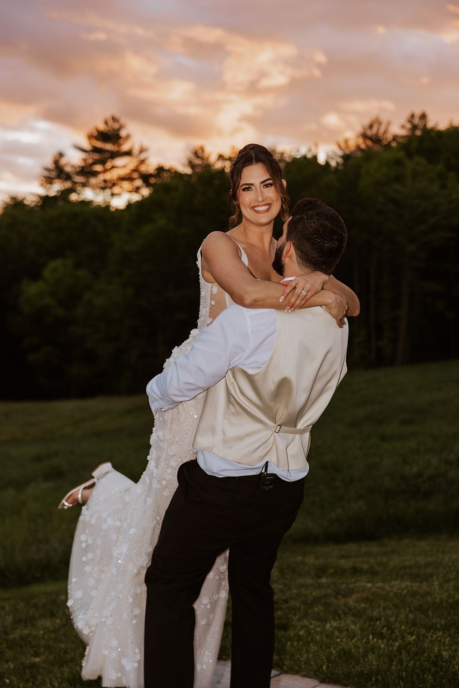 Bride and groom taking sunset portraits at their Longlook Farm wedding in NH