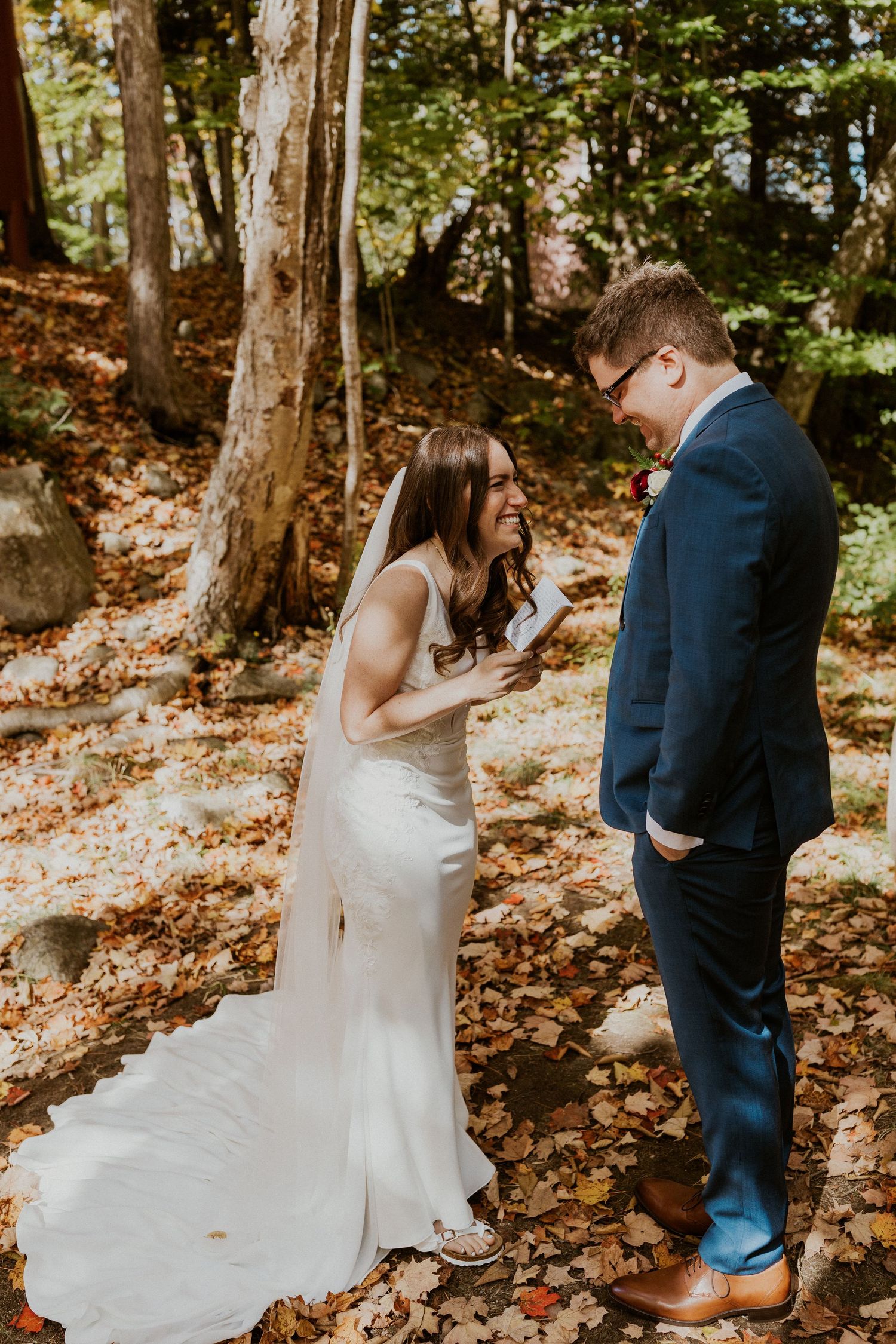 Briana reading her private vows to Daniel along the Pemi River in Woodstock New Hampshire.