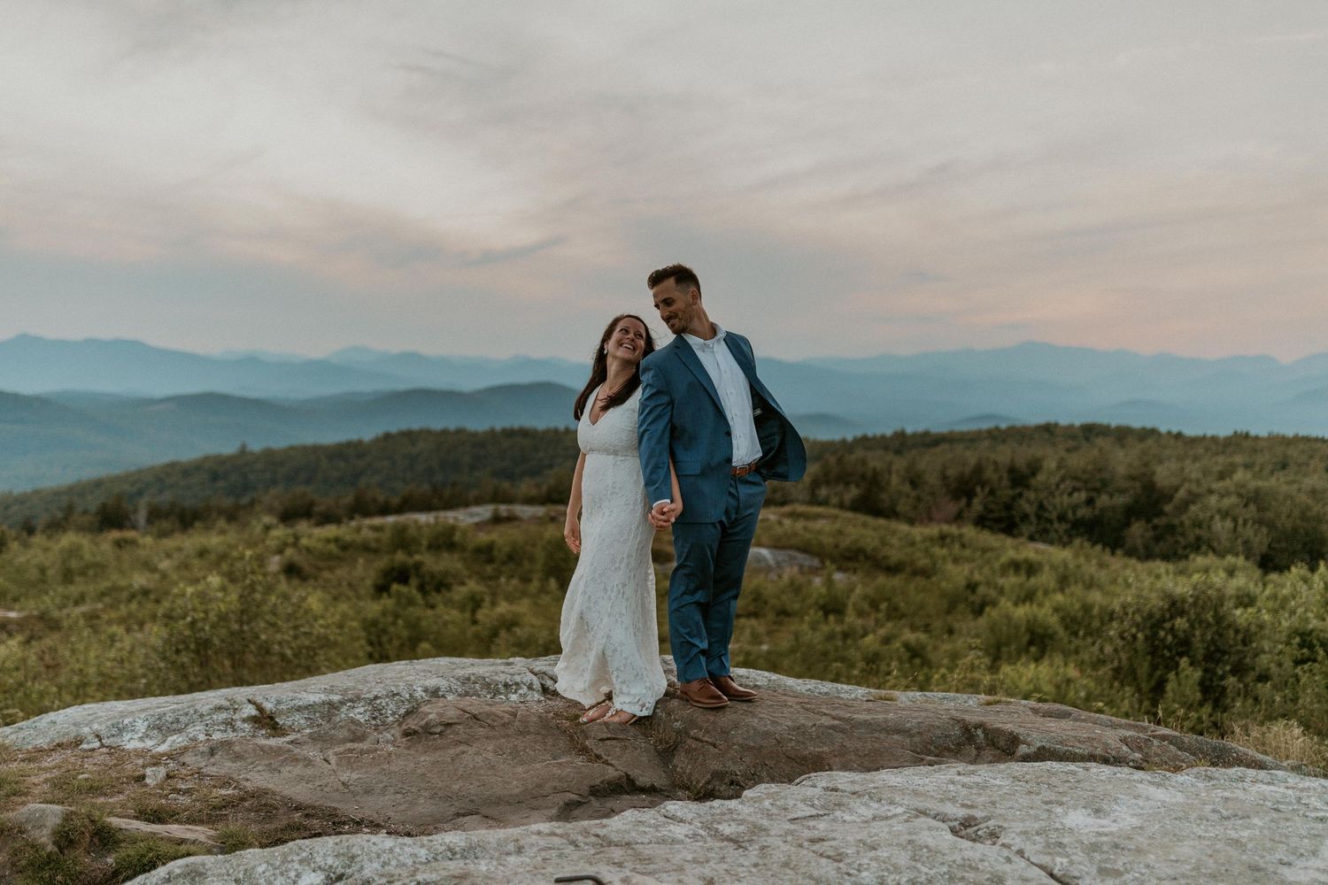 Danielle and Colin dressed in their wedding attire for their one year anniversary photoshoot on Foss Mountain in NH.