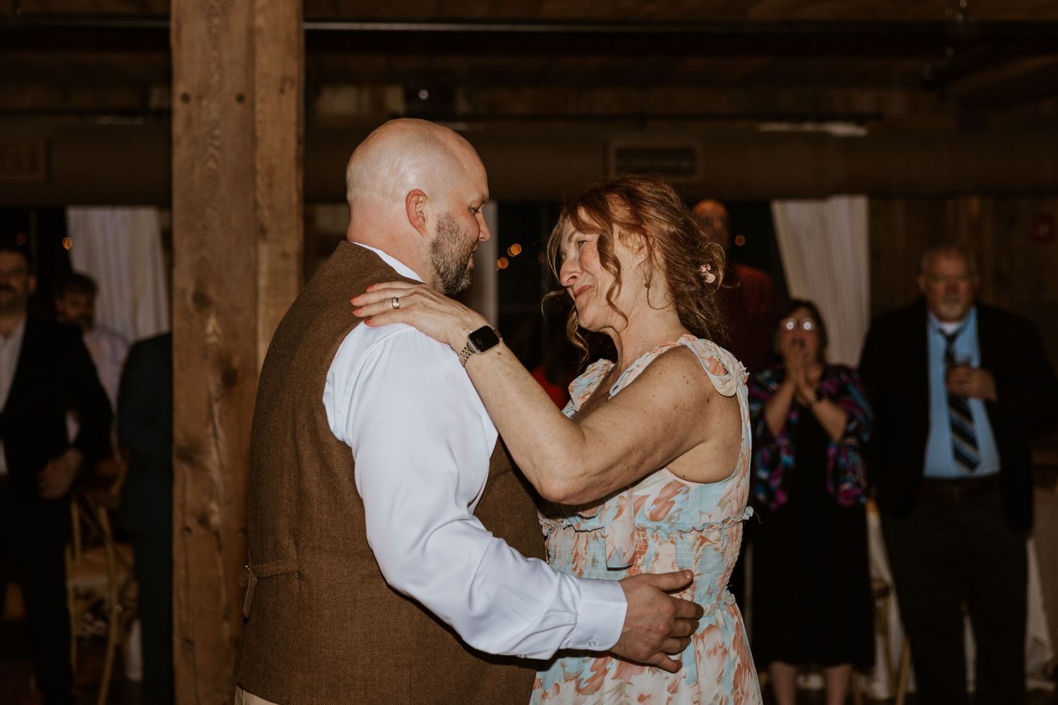 Intimate first dance moment at rustic barn wedding reception.