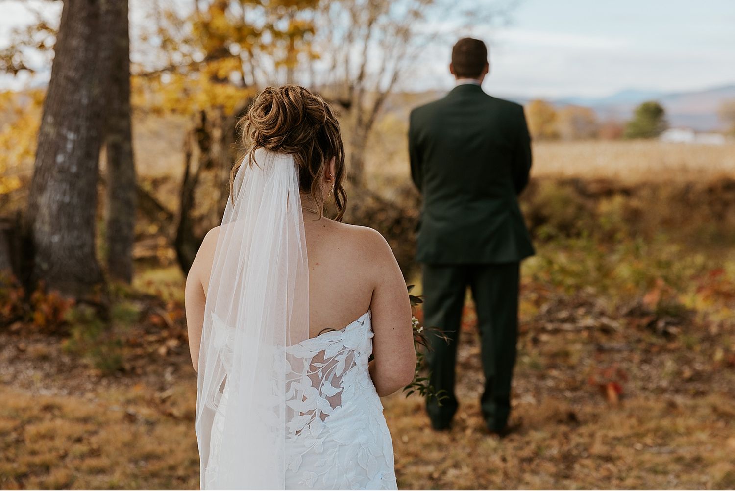 Bride and groom taking first look wedding photos for their NH wedding