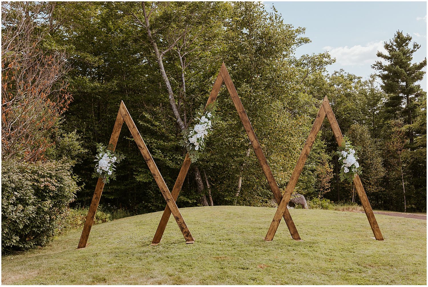 Triangle wedding ceremony arch for a VRBO wedding in Maine