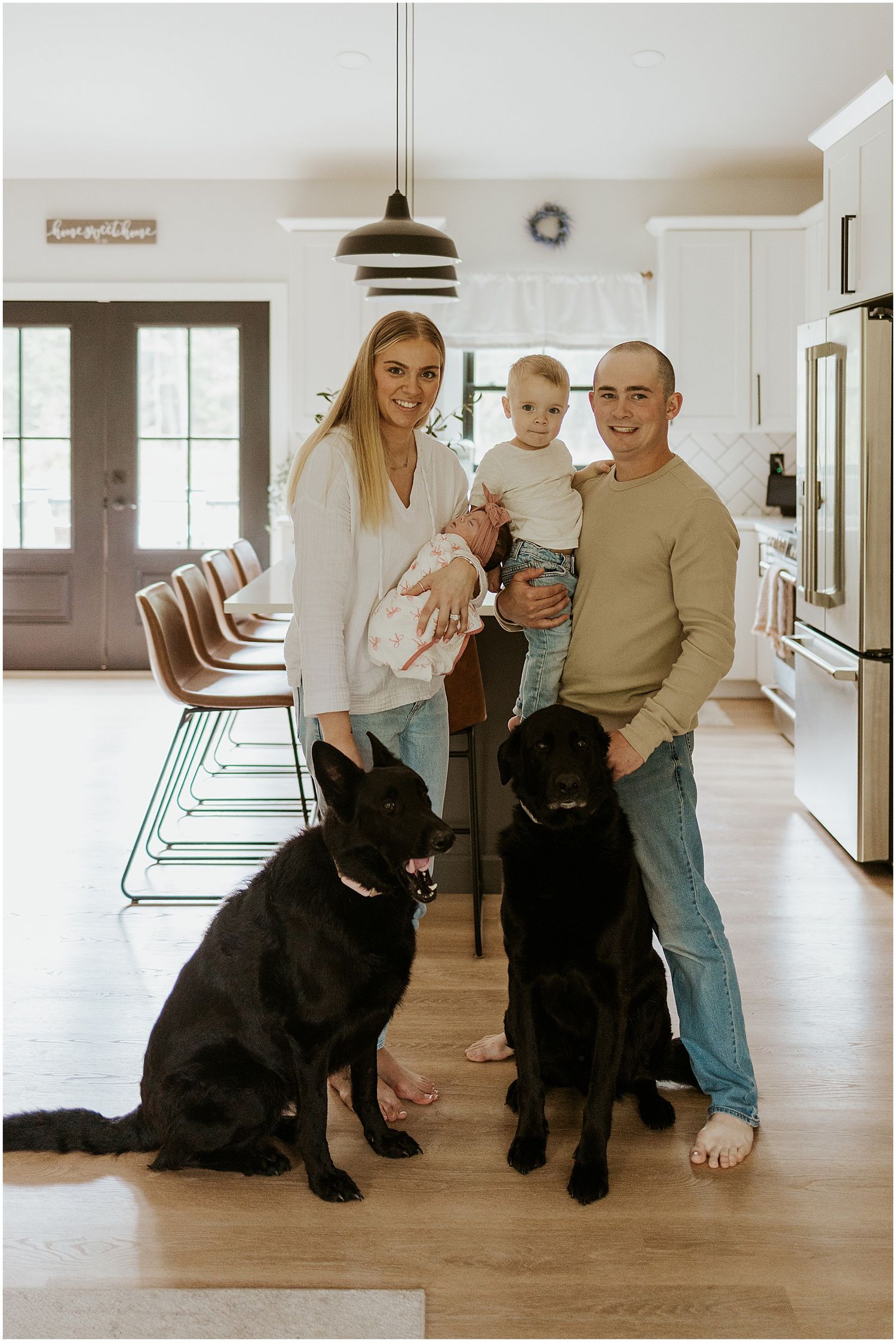A New Hampshire family taking newborn family photos at their home in New Hampshire