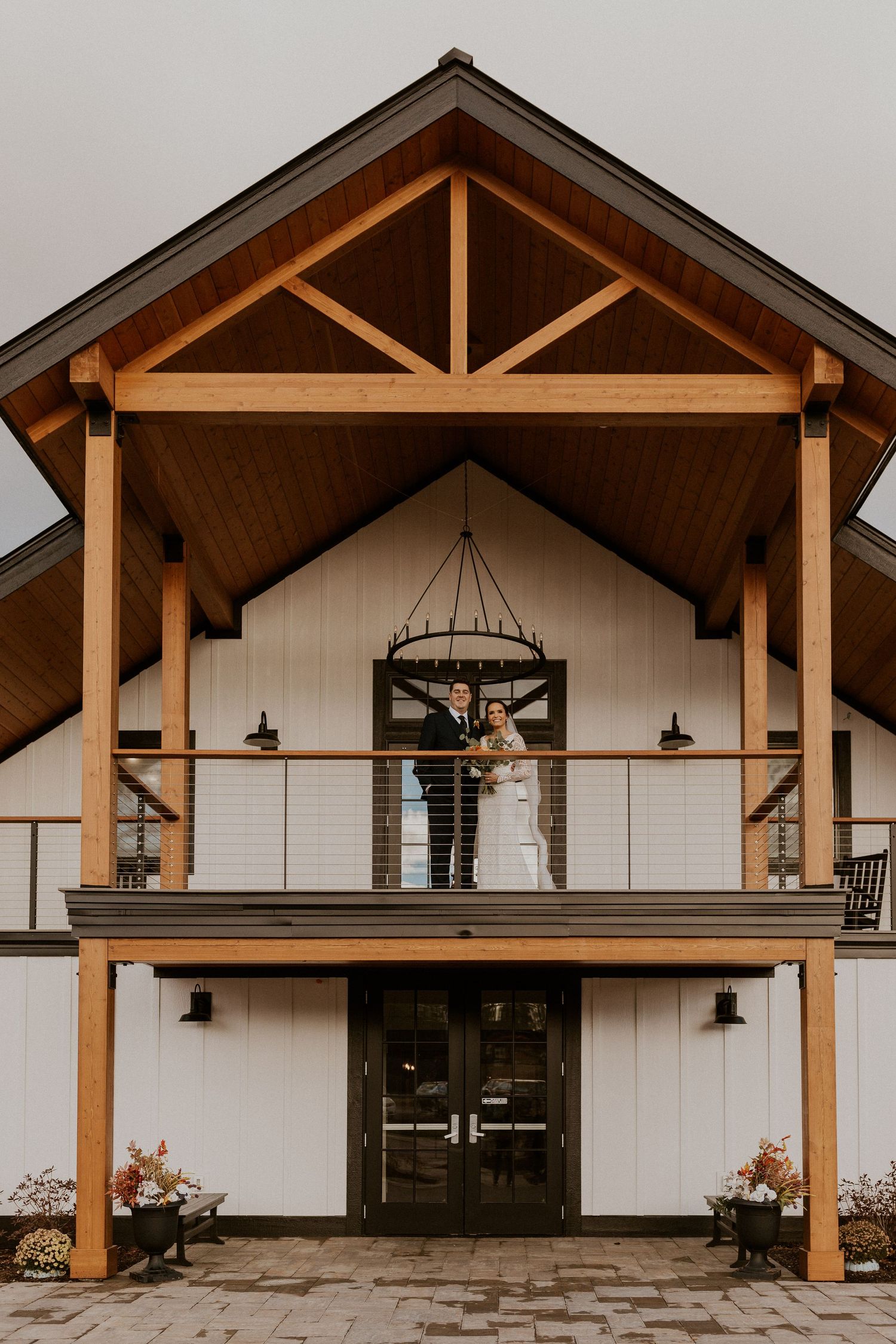 Bride and groom holding each other intimately during portraits at Owl's Nest Resort in Thornton, New Hampshire.
