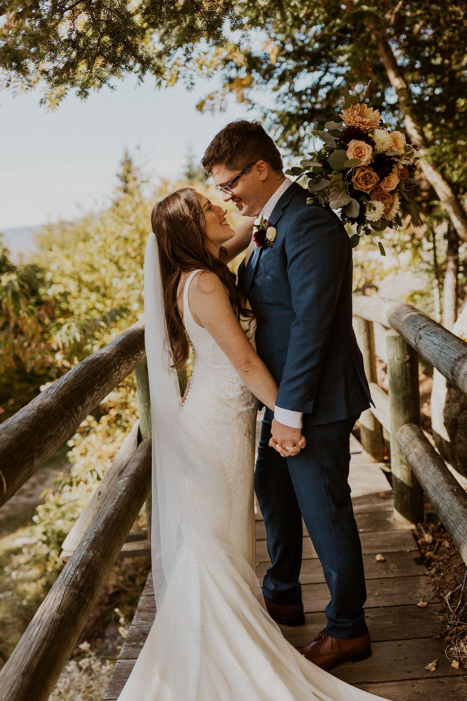 Portraits of the newlyweds on top of Loon Mountain after their fall wedding ceremony.