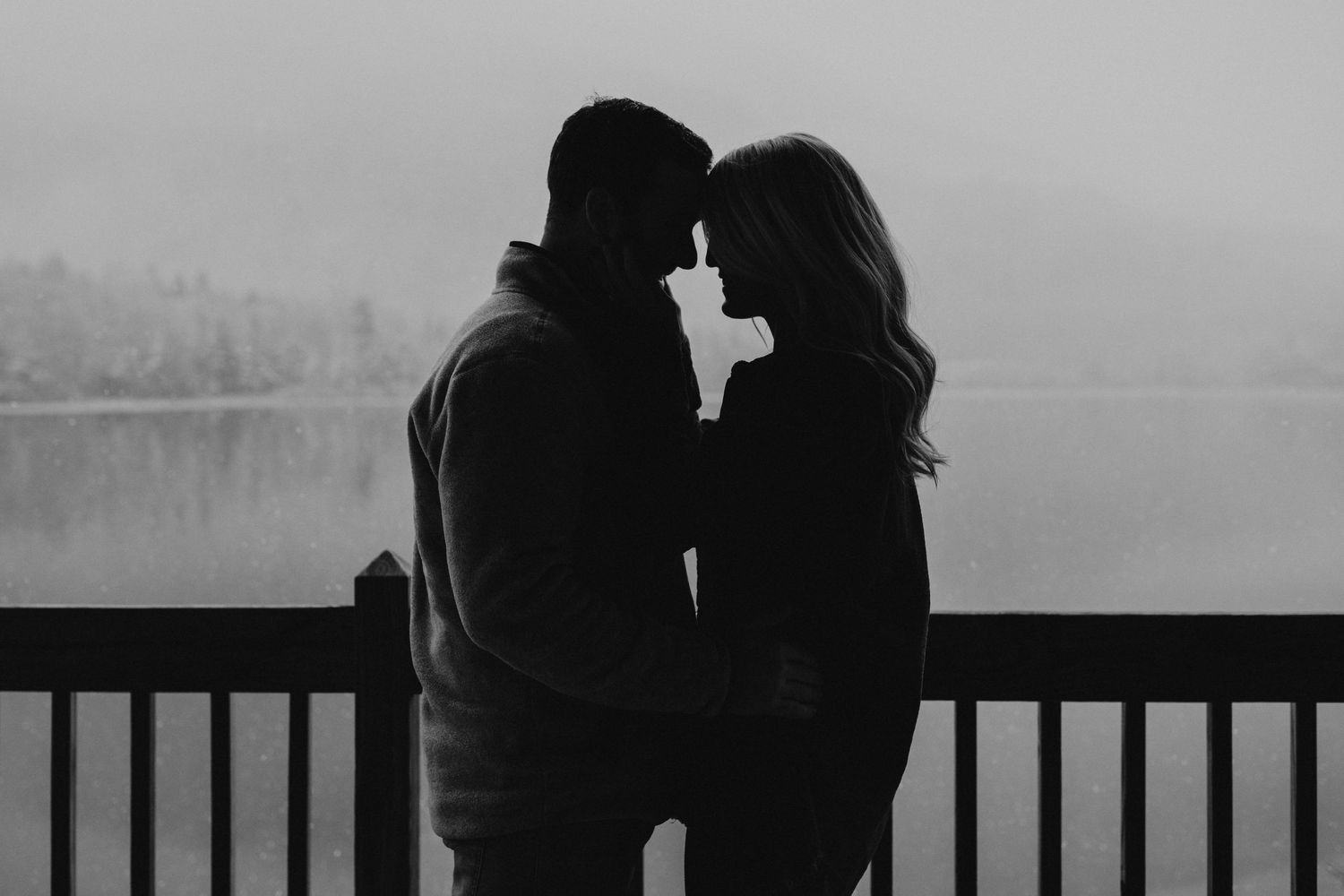 Newly engaged couple playfully posing for photos during their engagement session in Franconia New Hampshire.